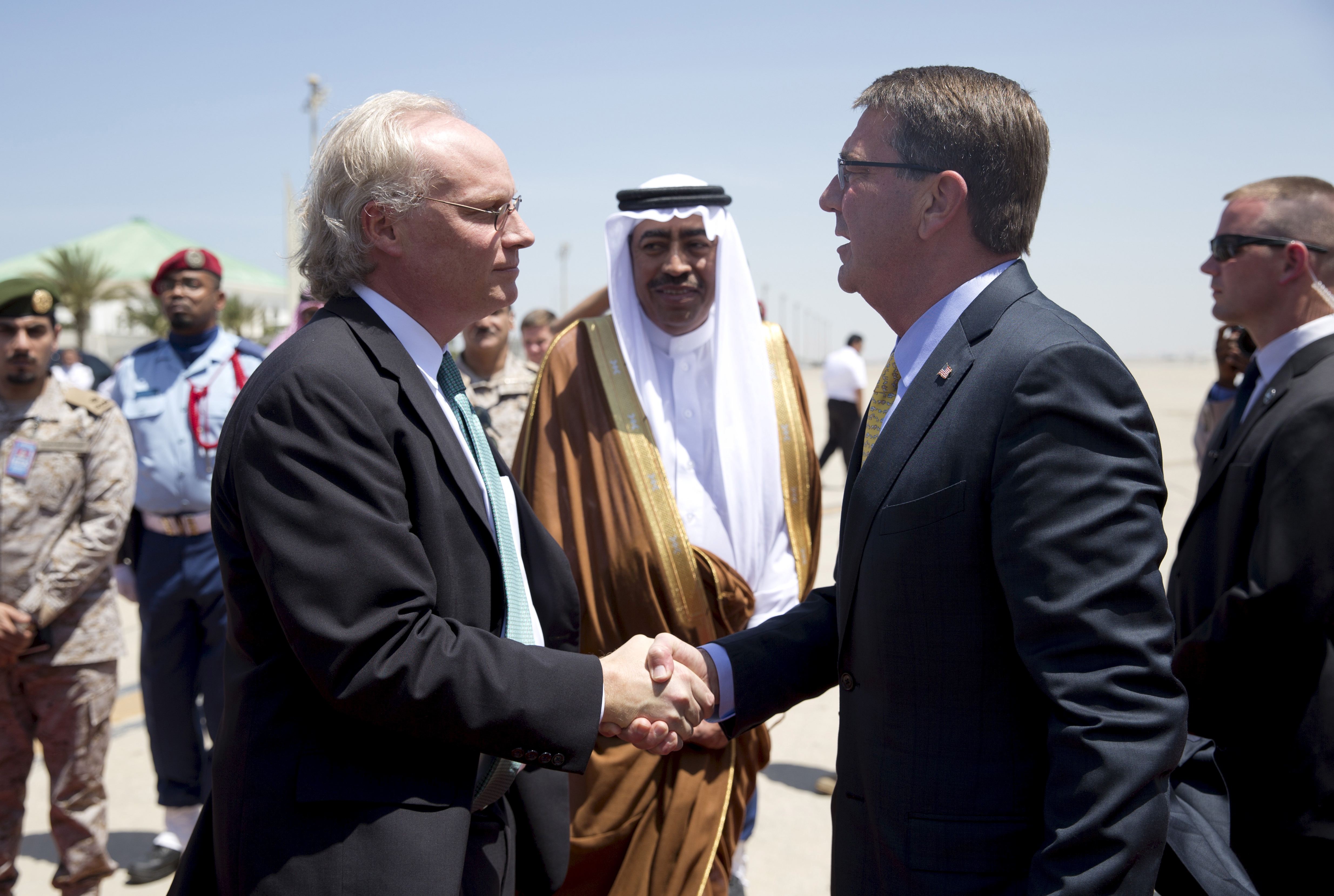 U.S. Defense Secretary Carter is greeted by U.S. Embassy Deputy Chief of Mission Lenderking and Saudi Arabian Assistant Minister of Defense Ayesh upon arrival in Jeddah