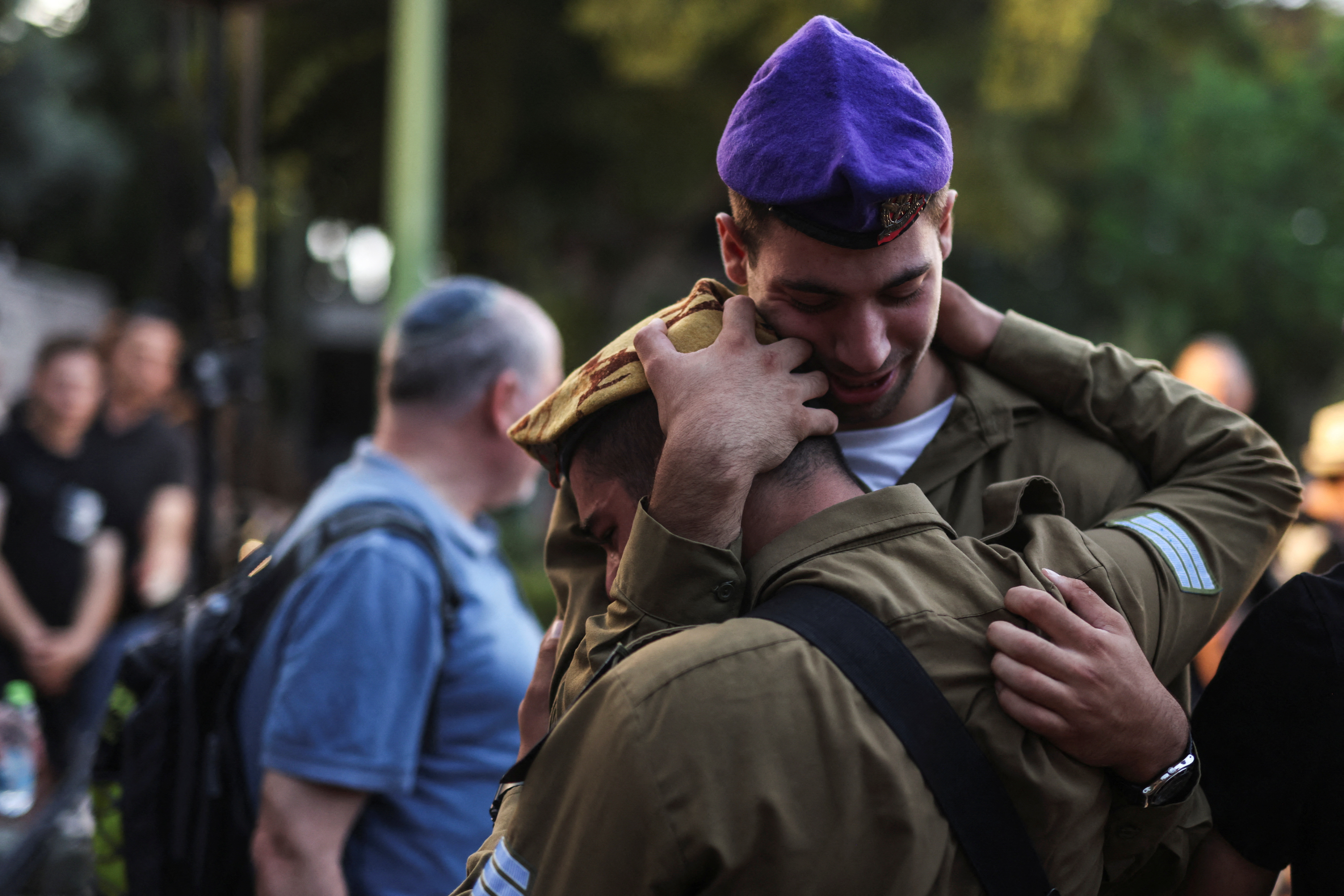 People mourn Ili Bar Sade, a soldier who was killed in an attack by Hamas militants, at his funeral in Tel Aviv