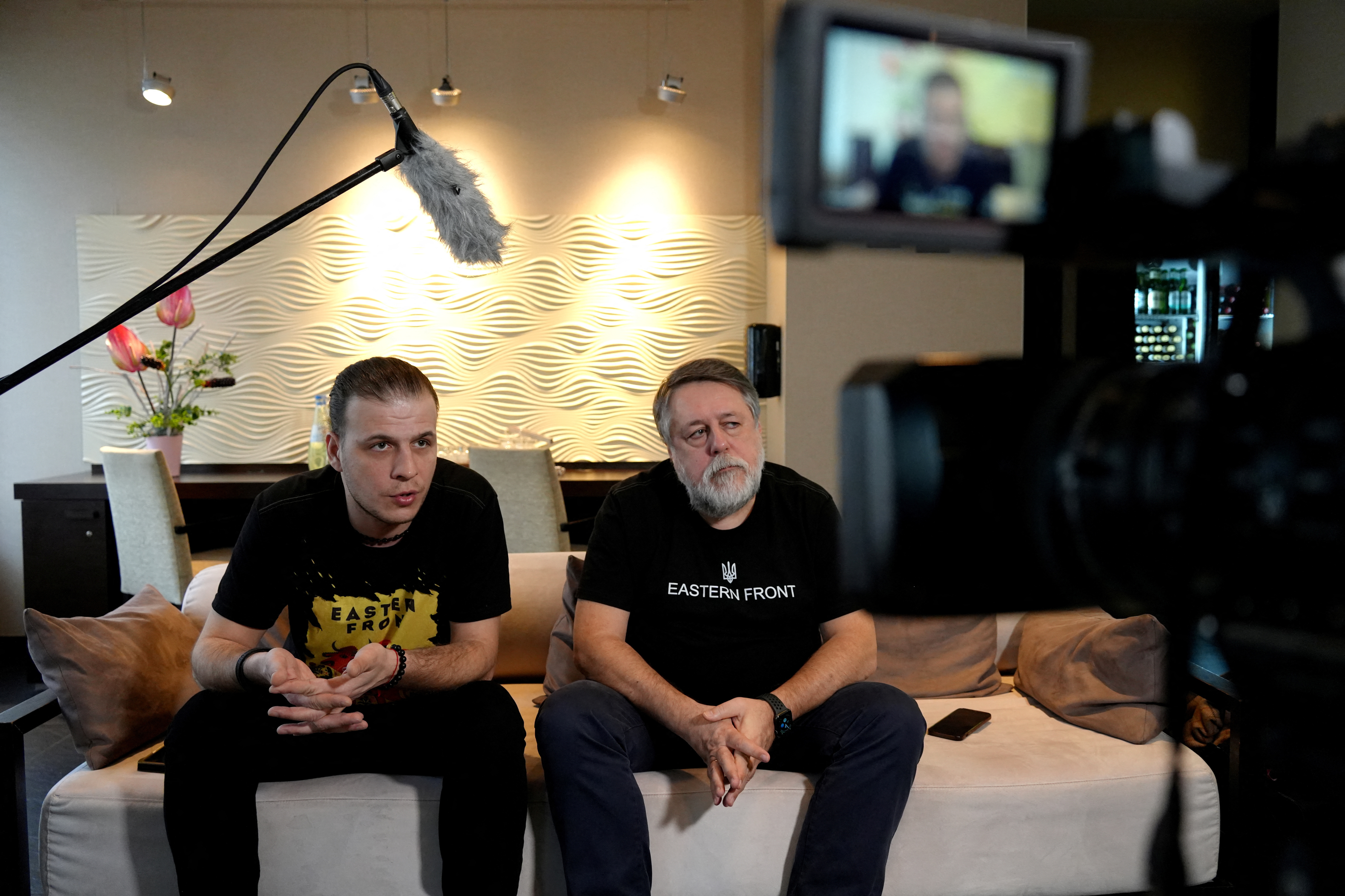 Directors Vitaly Mansky and Yehven Titarenko speak about the movie 'Eastern Front' during a Reuters interview in Berlin