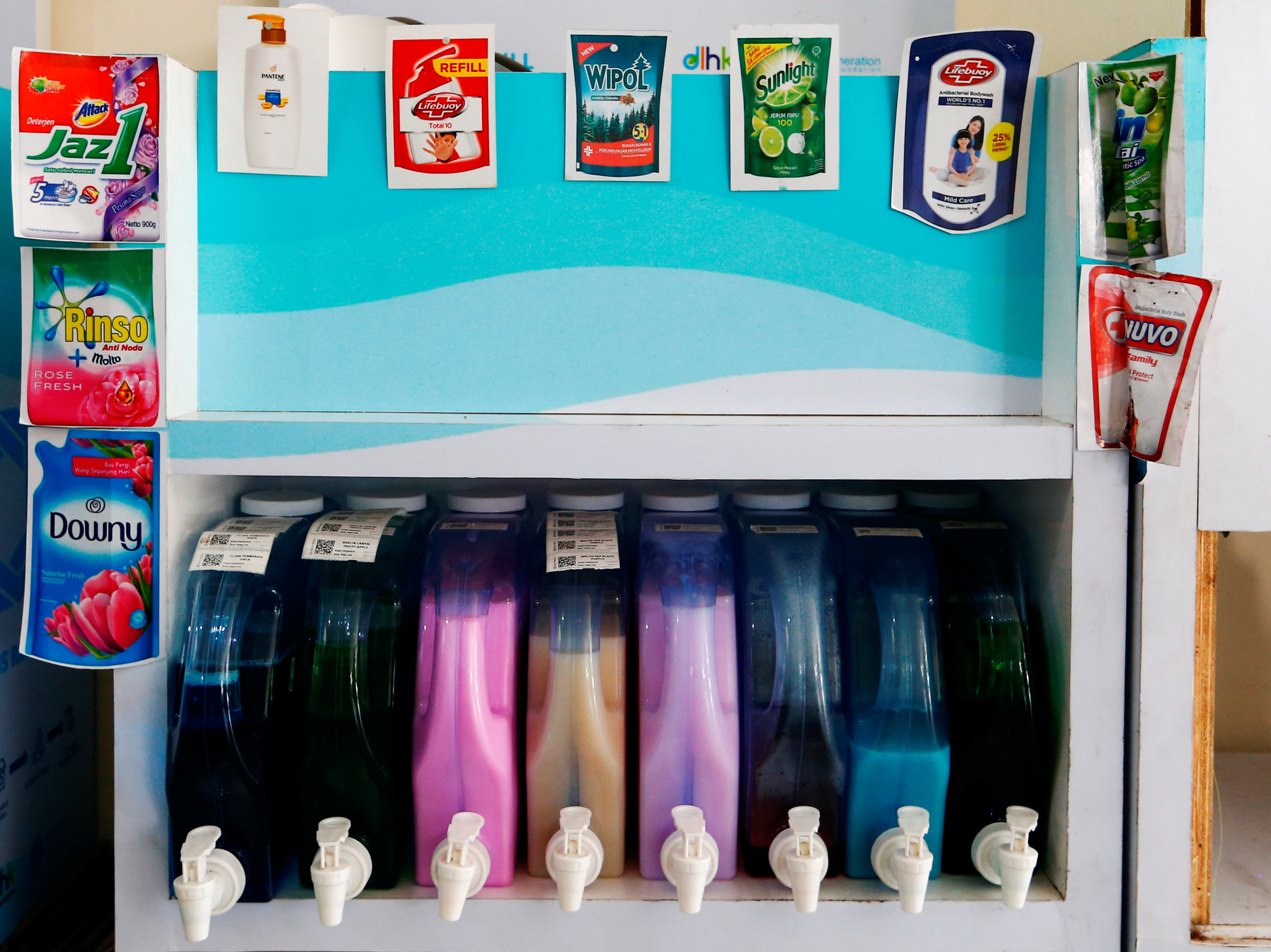Dispensers containing cleaning liquids are seen at a Siklus office, a start-up company which refills household products in a bid to reduce plastic waste, in Jakarta, Indonesia, May 19, 2021. Picture taken May 19, 2021 REUTERS/Ajeng Dinar Ulfiana