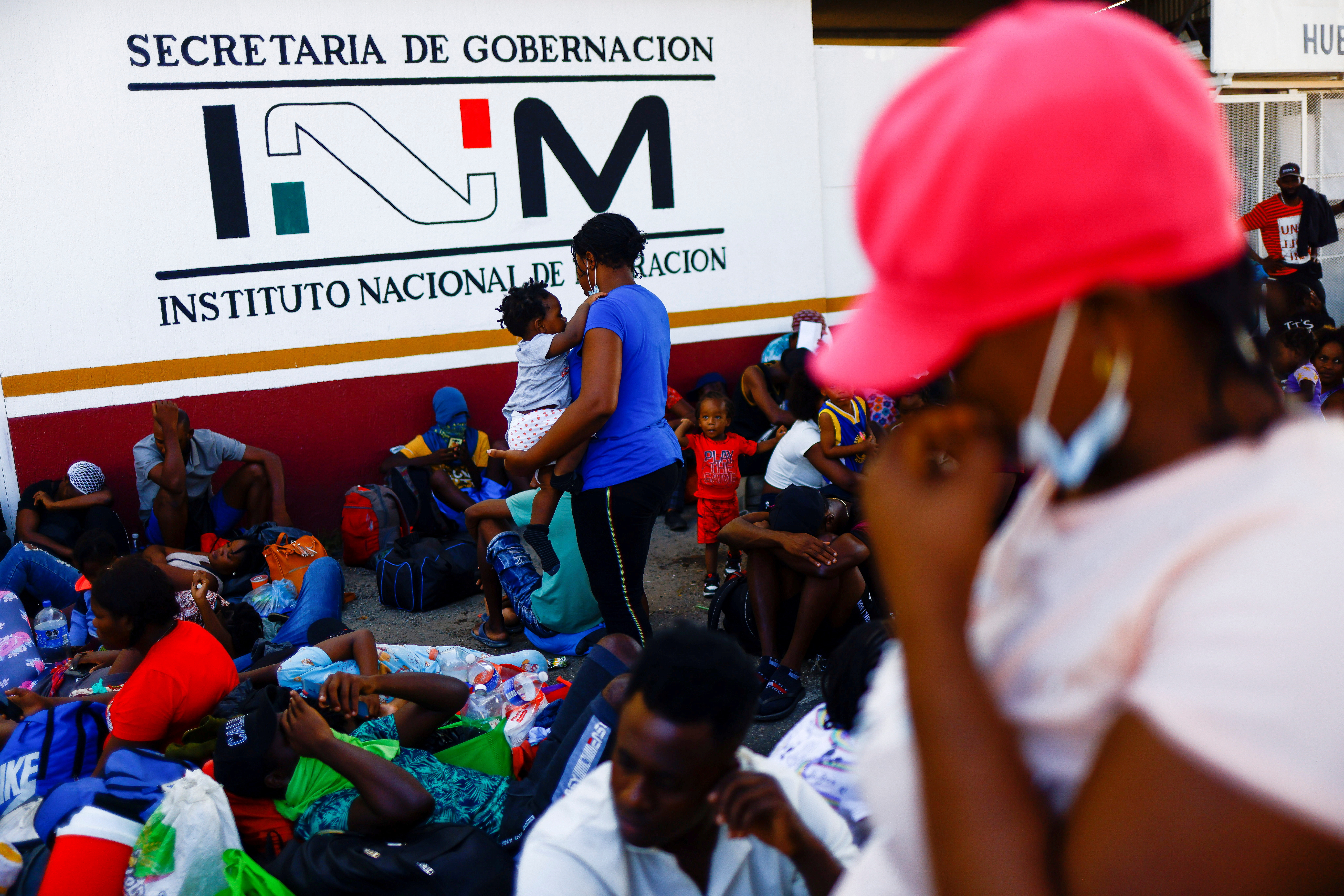 Migrants rest as they take part in a caravan heading to the U.S. border, near Huehuetan, Mexico November 29, 2021. REUTERS/Jose Luis Gonzalez  