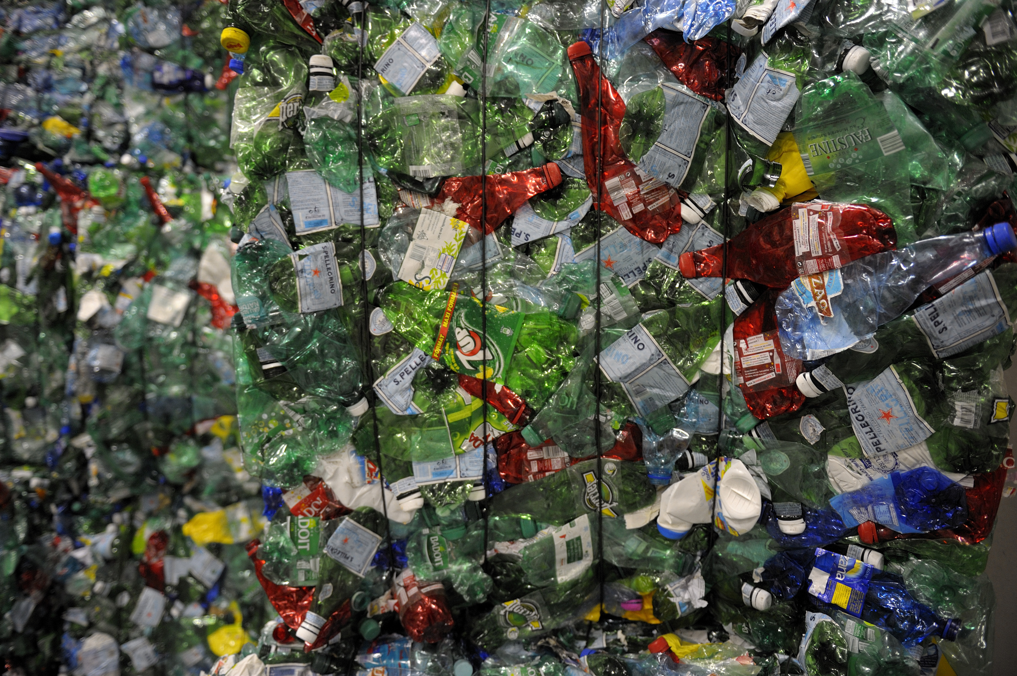 Crushed plastic bottles are seen at a recycling centre in Paris