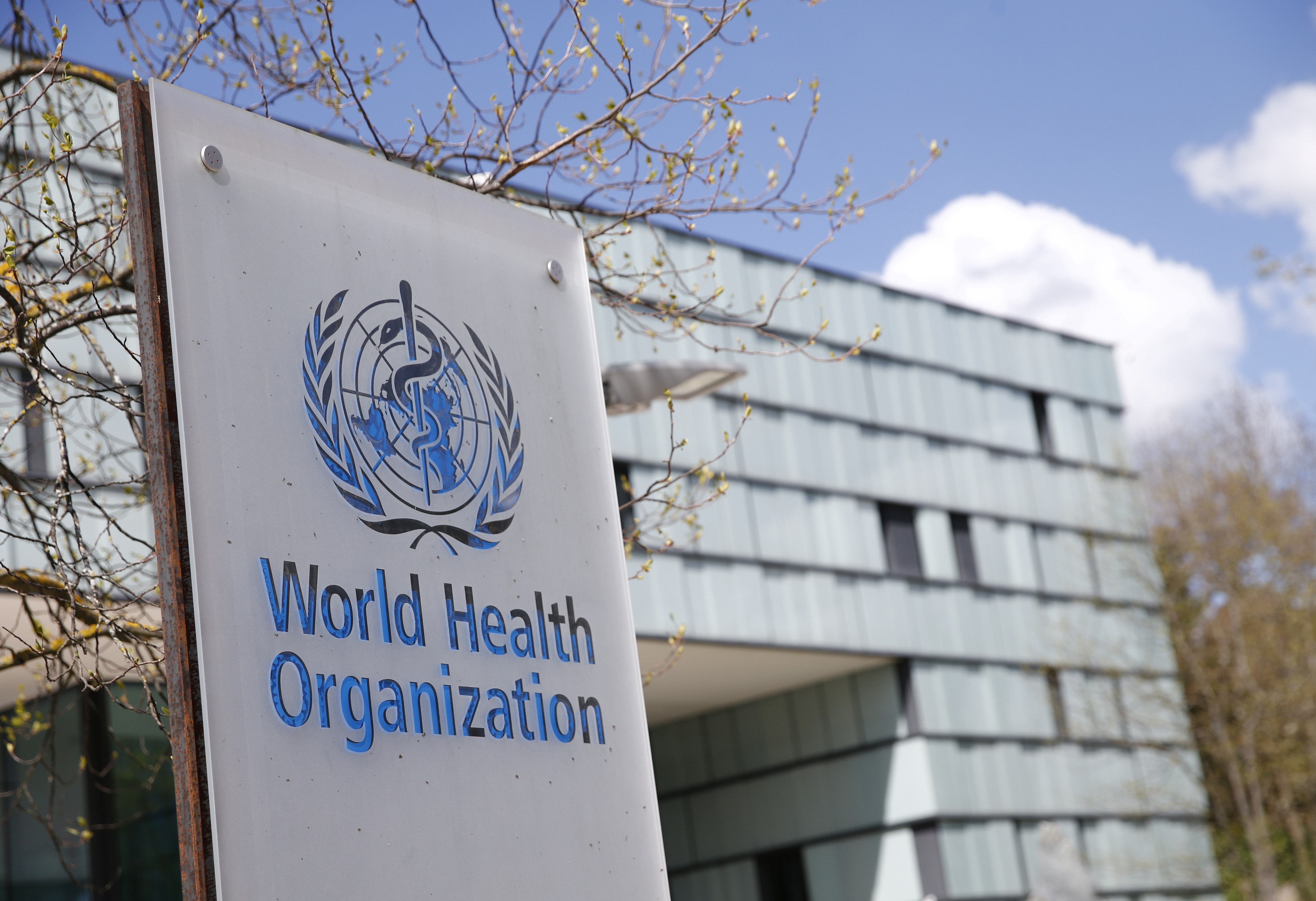 A logo is pictured outside a building of the World Health Organization (WHO) during an executive board meeting on update on the coronavirus disease (COVID-19) outbreak, in Geneva, Switzerland, April 6, 2021. REUTERS/Denis Balibouse