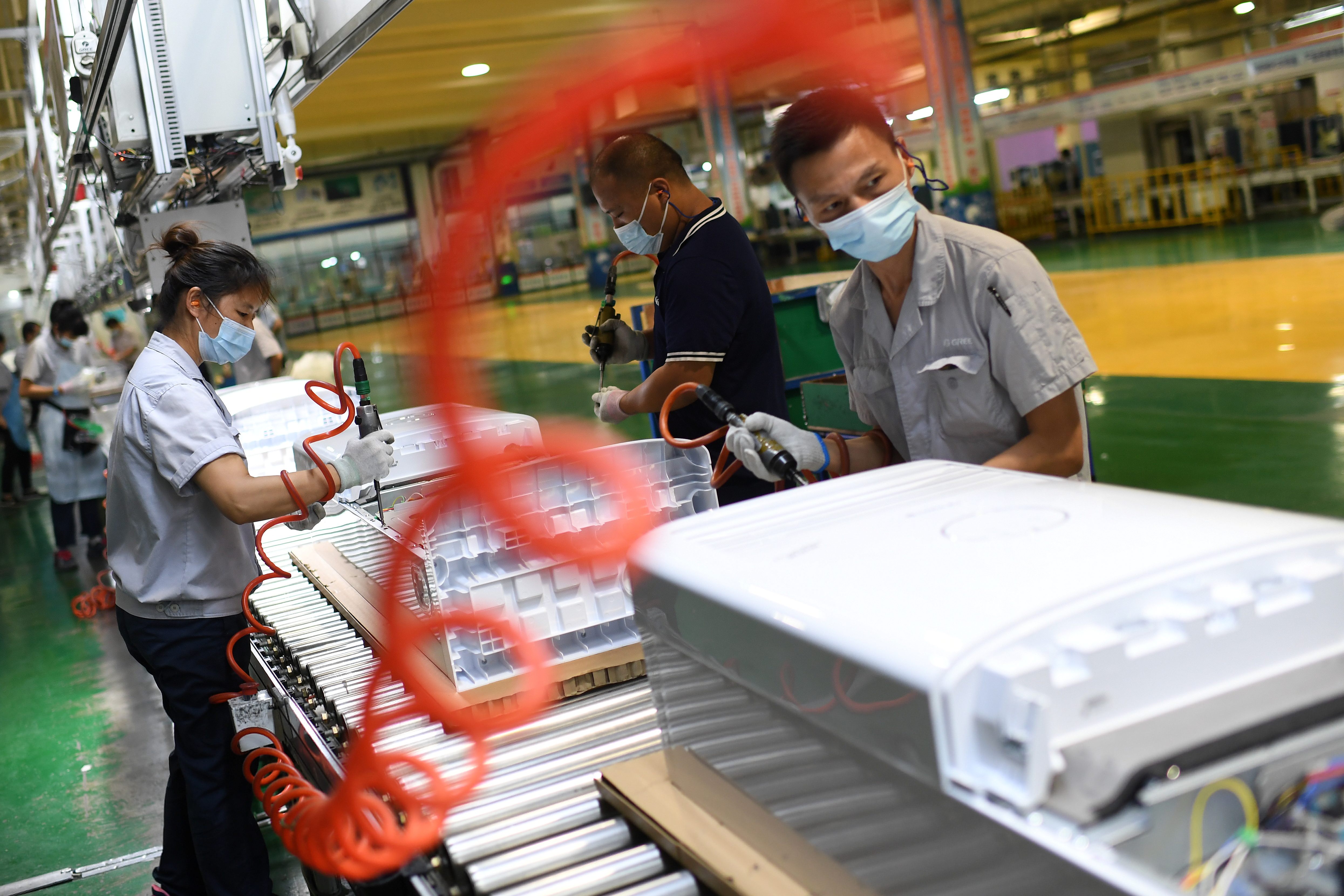 Employees work at a Gree factory following the COVID-19 outbreak in Wuhan