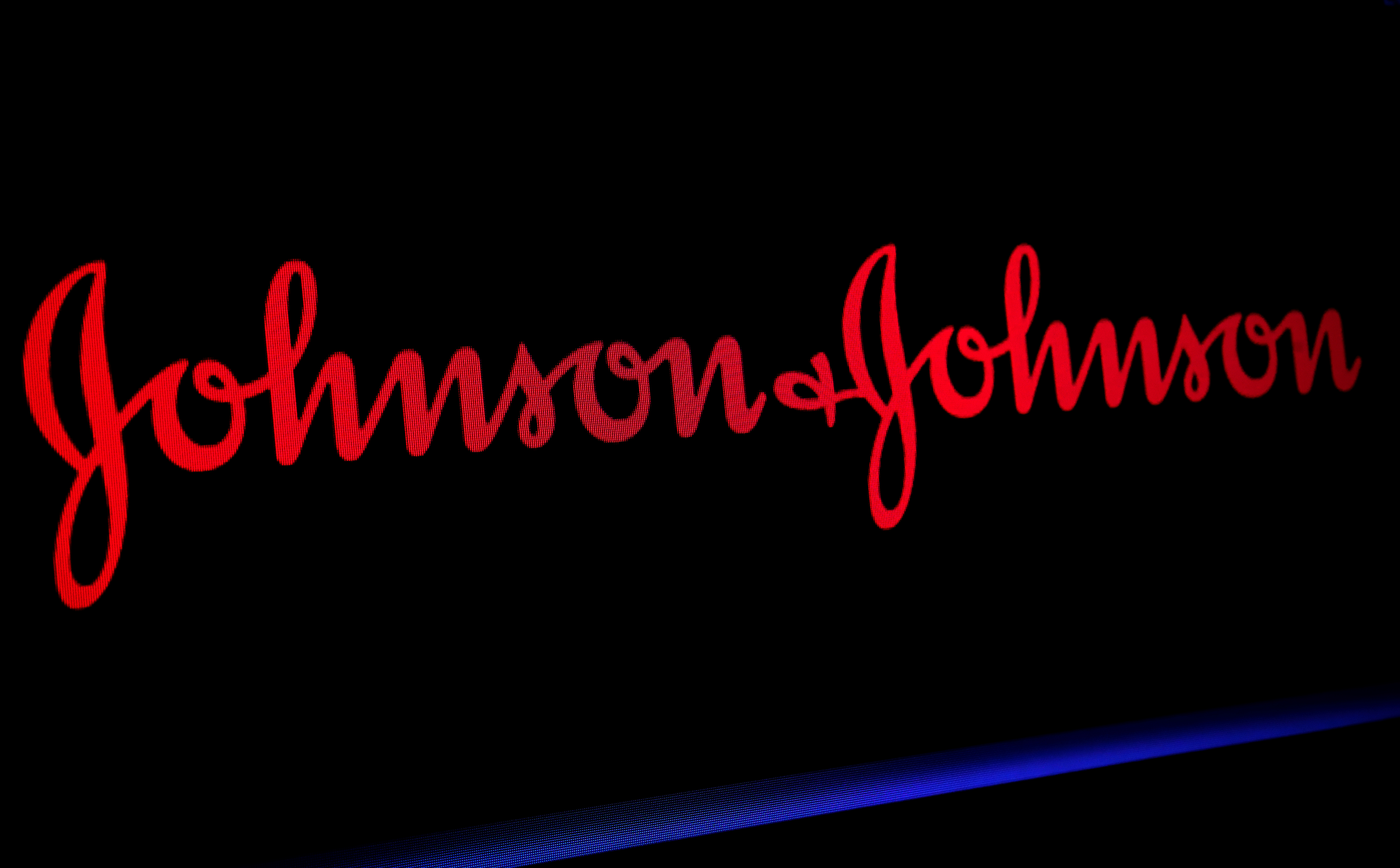 The Johnson & Johnson logo is displayed on a screen on the floor of the NYSE in New York