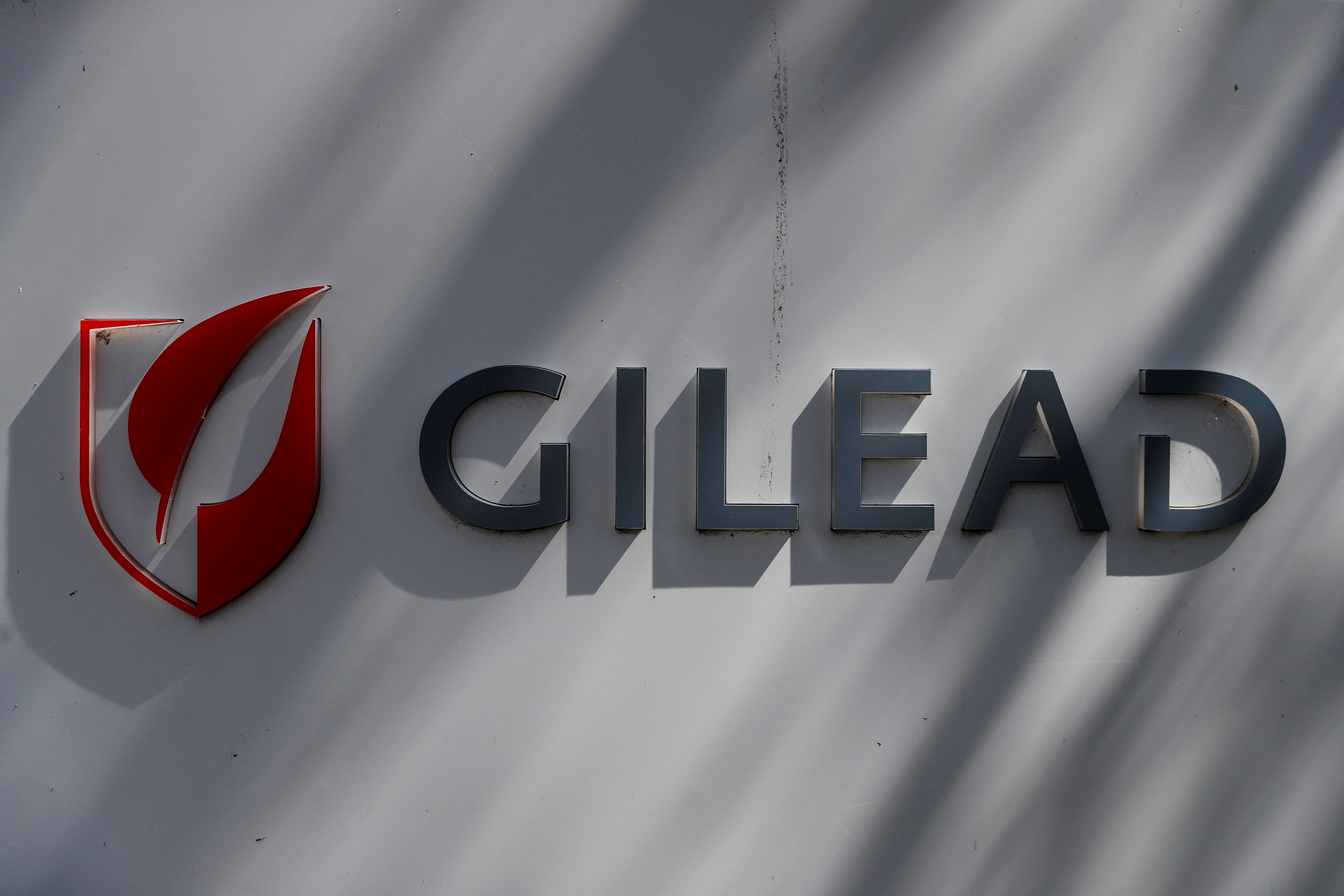 A Gilead Sciences, Inc. logo is seen outside the company headquarters in Foster City, California