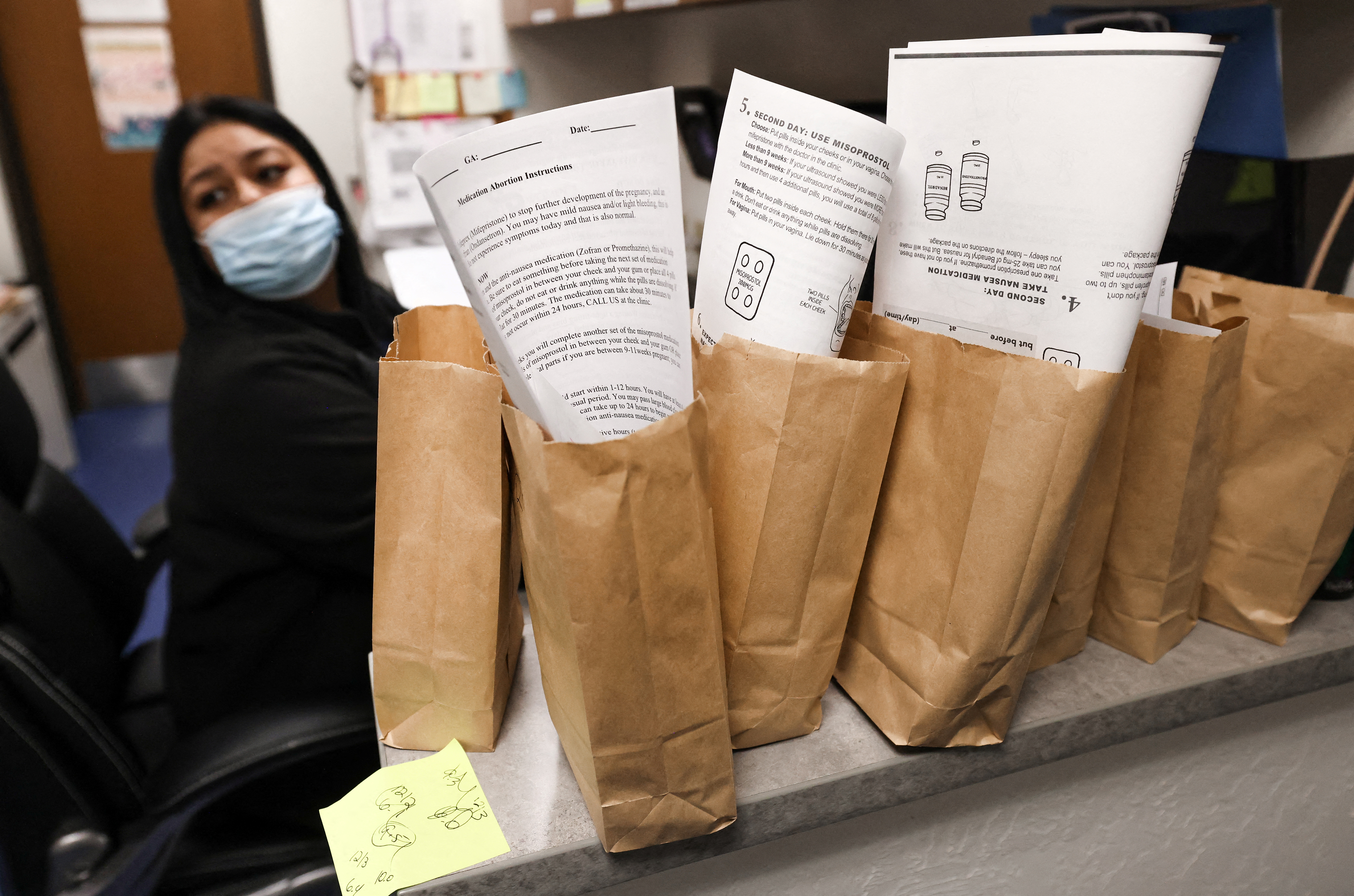 A patient care coordinator prepares bags containing the medication used for a medical abortion and follow-up instructions for patients who will be having abortions that day at Trust Women clinic in Oklahoma City, U.S., December 6, 2021. Of the 20 abortions performed that day, 17 of the patients came from Texas. REUTERS/Evelyn Hockstein
