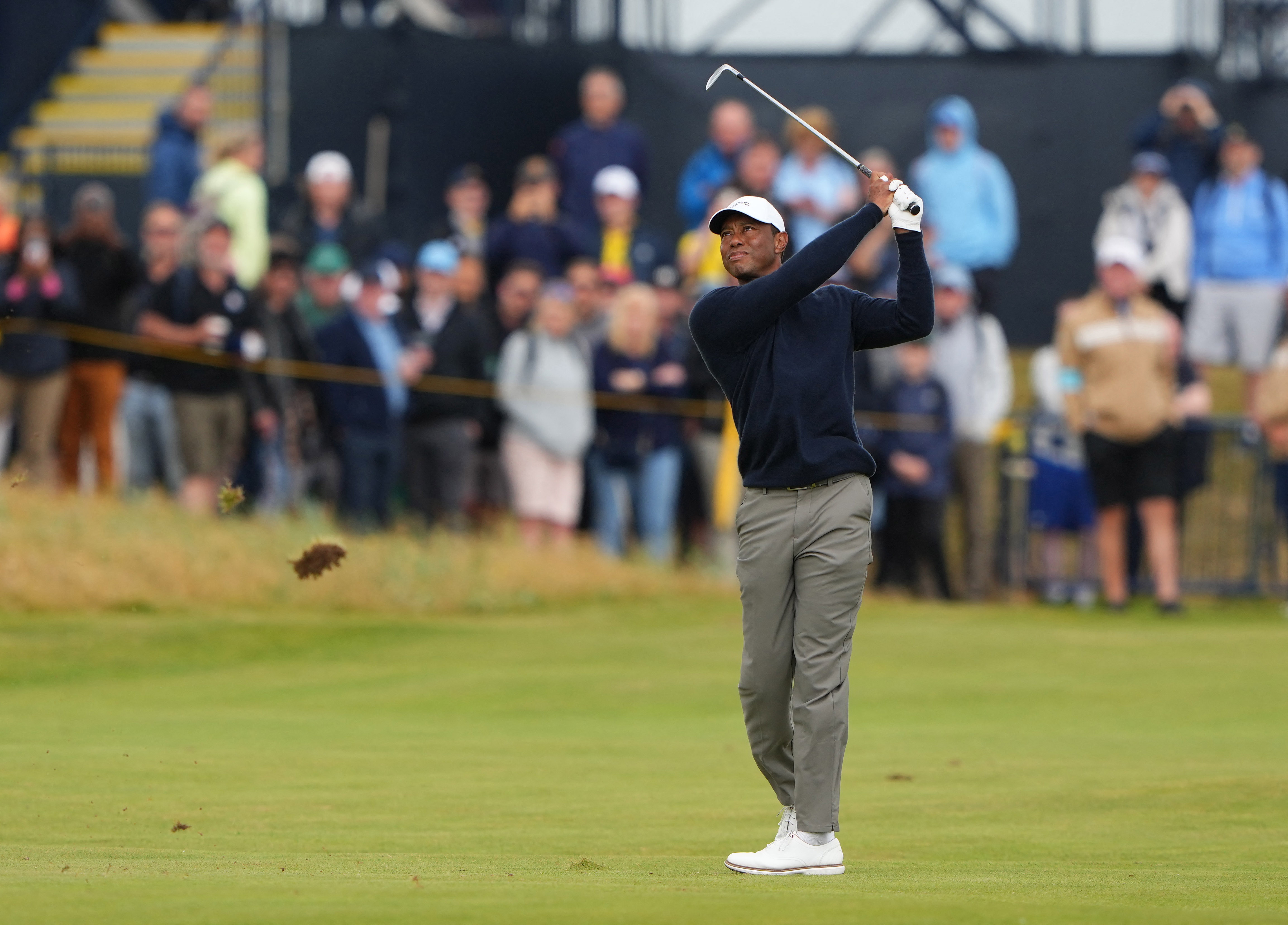 Tiger Woods making an iron swing during a 2025 charity golf event