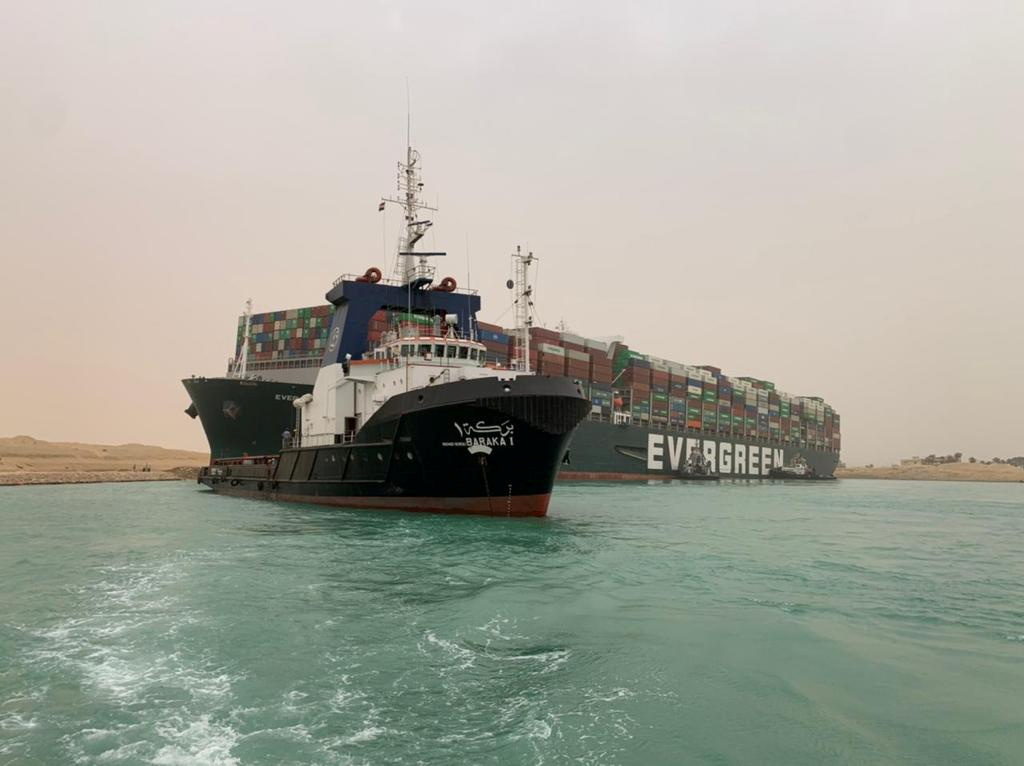 Container ship runs aground in Suez Canal, blocks traffic