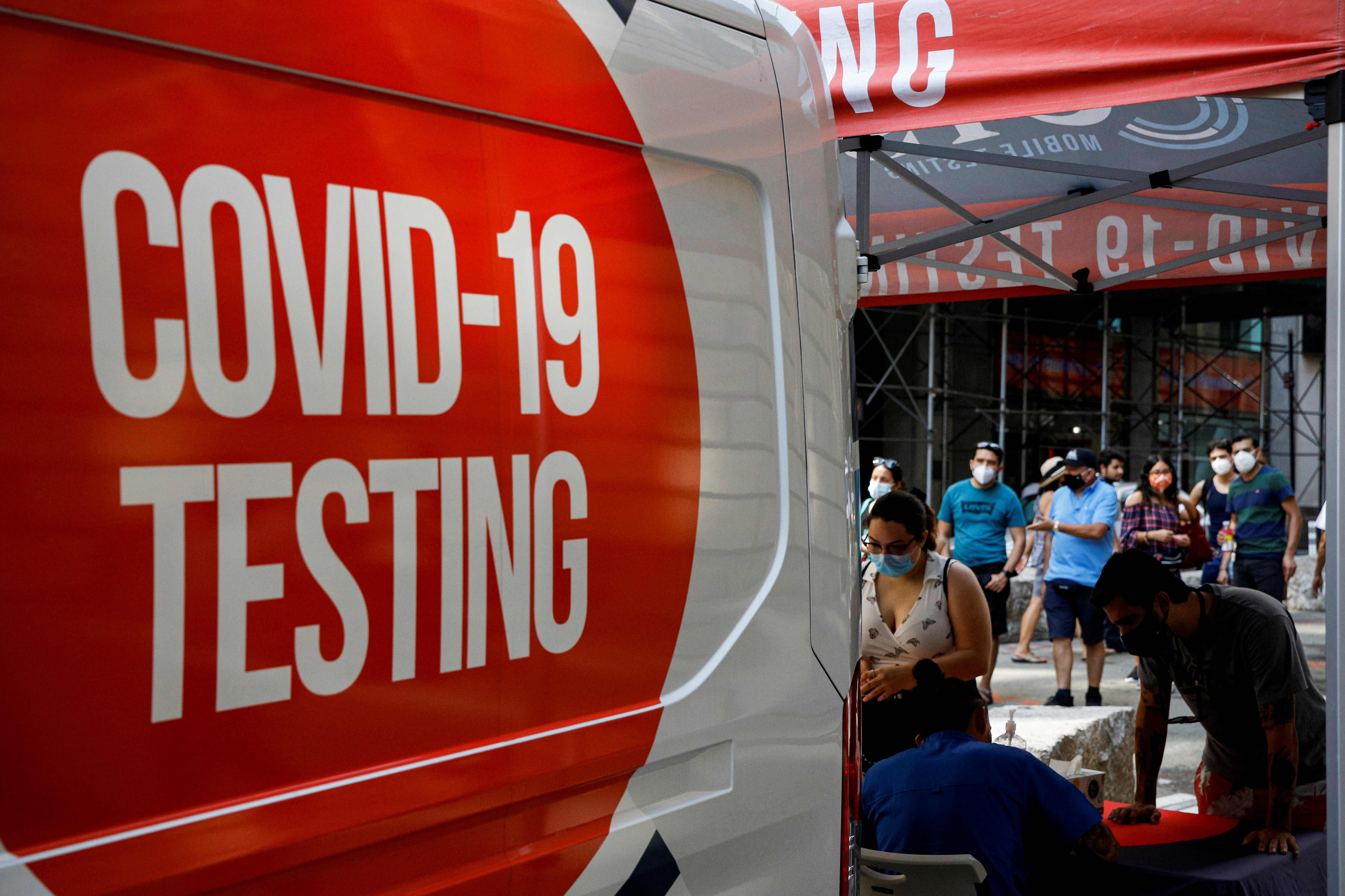 People line up at a coronavirus disease (COVID-19) testing at a mobile testing van in New York