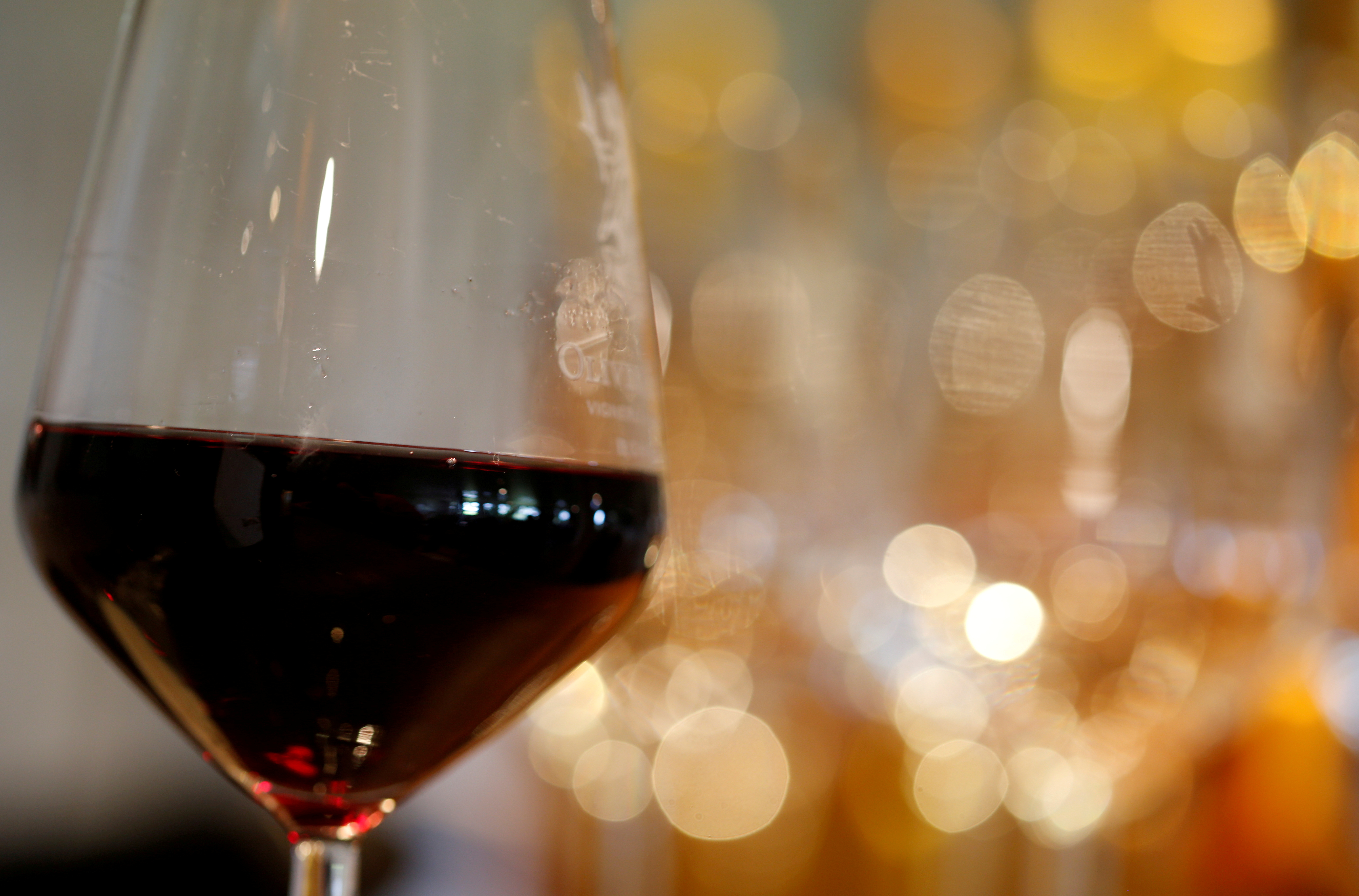 A glass of French red wine is displayed at the Chateau du Pavillon in Sainte-Croix-Du-Mont,