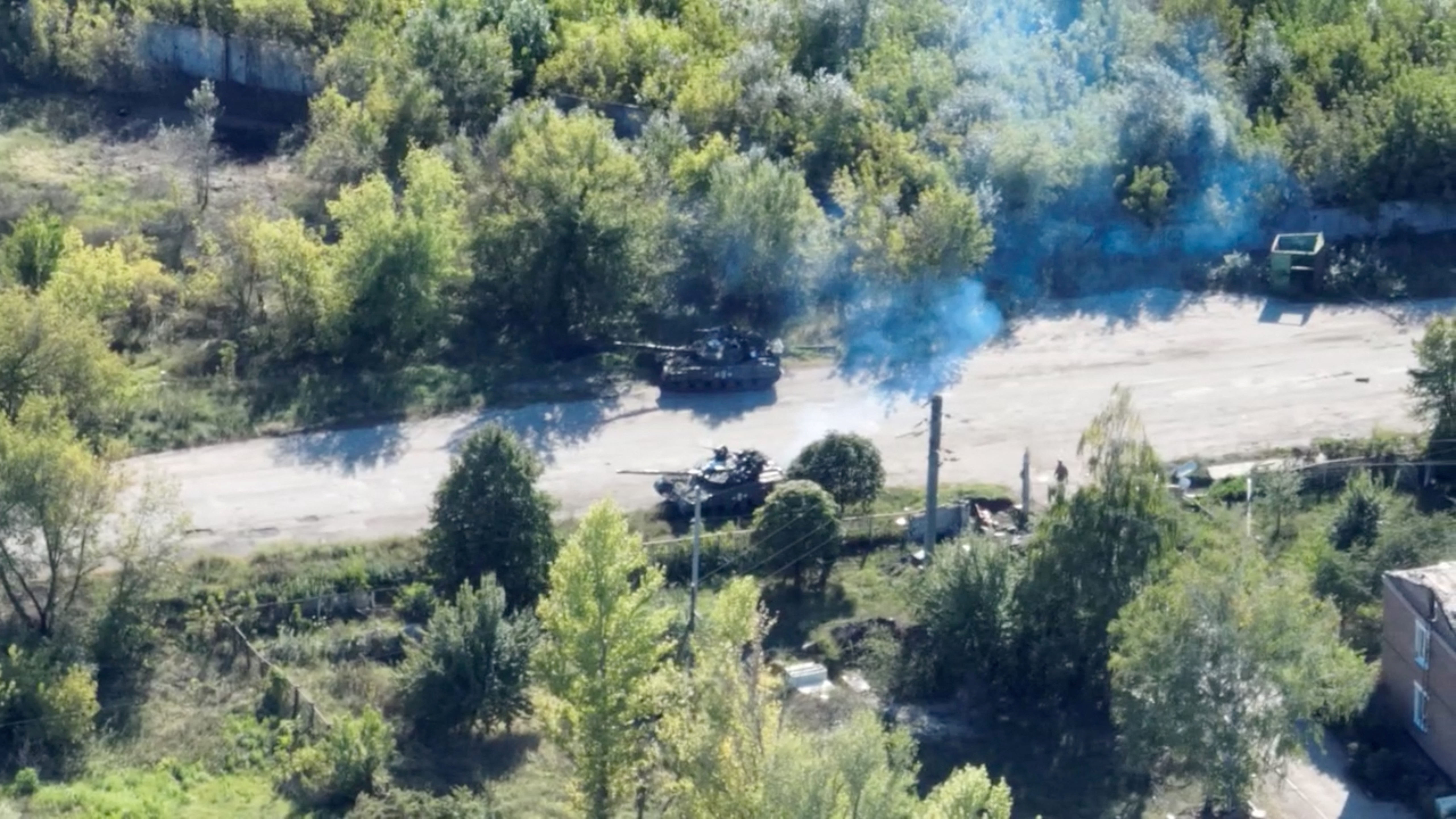 Drone footage shows armoured vehicles on the roadside in Balakliia