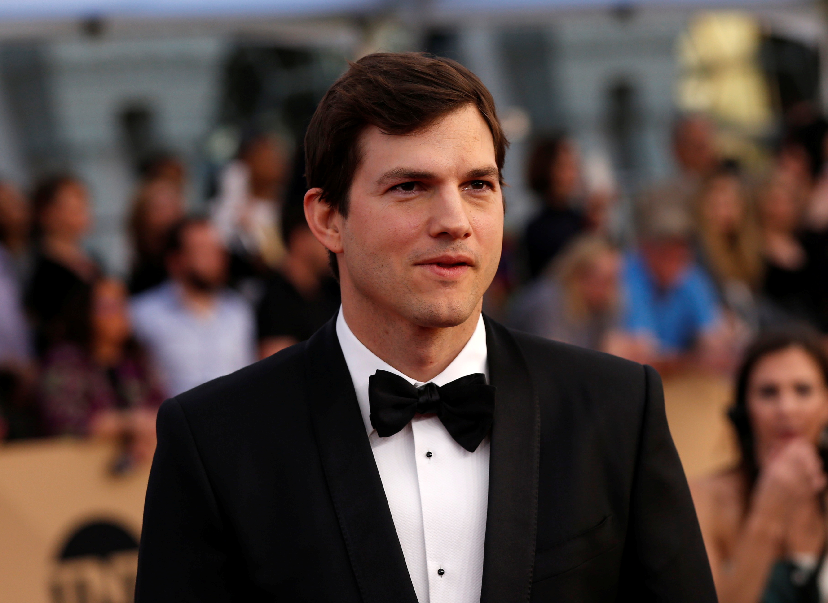 Actor Ashton Kutcher arrives at the 23rd Screen Actors Guild Awards in Los Angeles