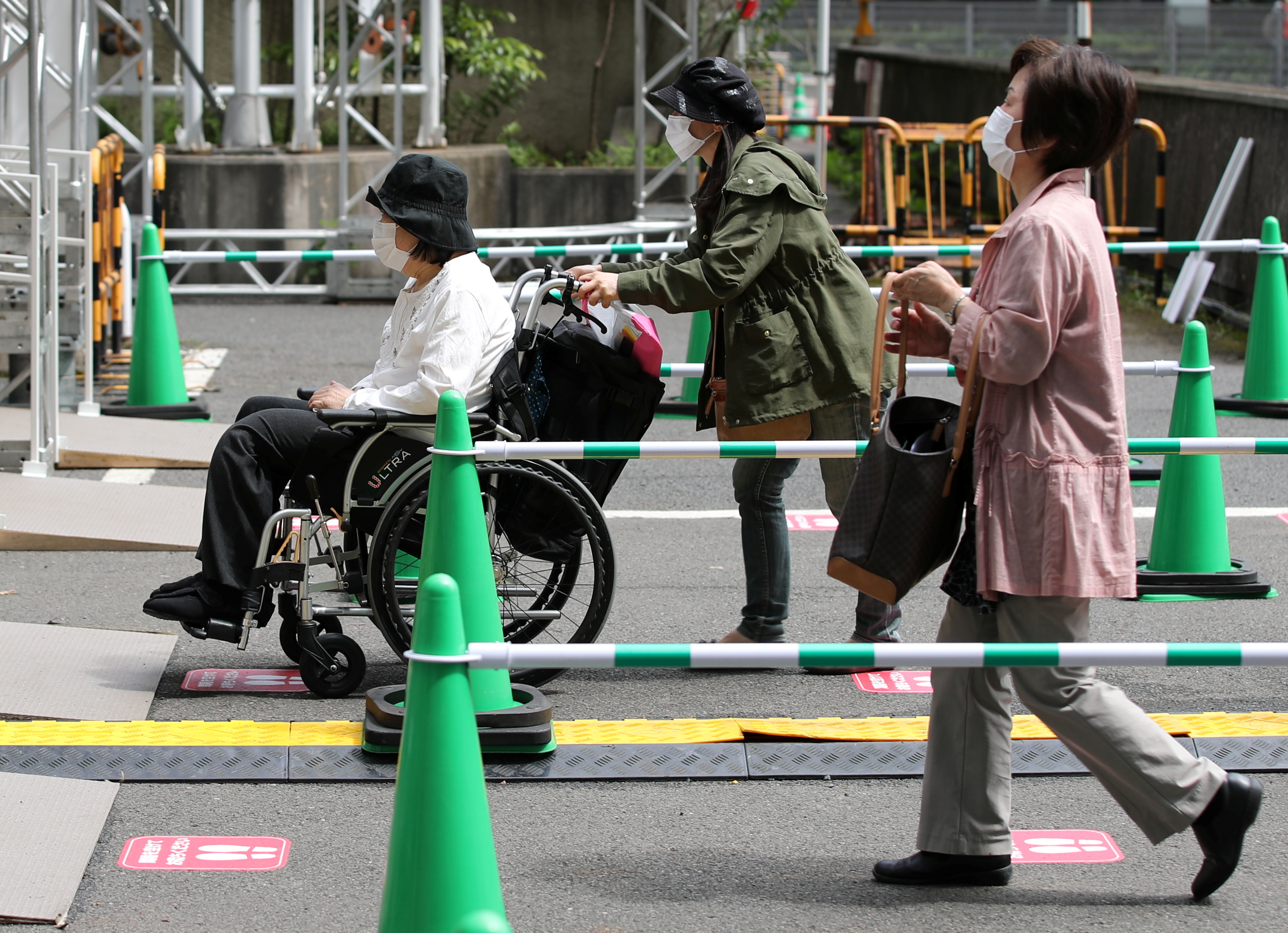 Japan Opens Mass Vaccination Sites For Elderly Ahead Of Olympics Reuters