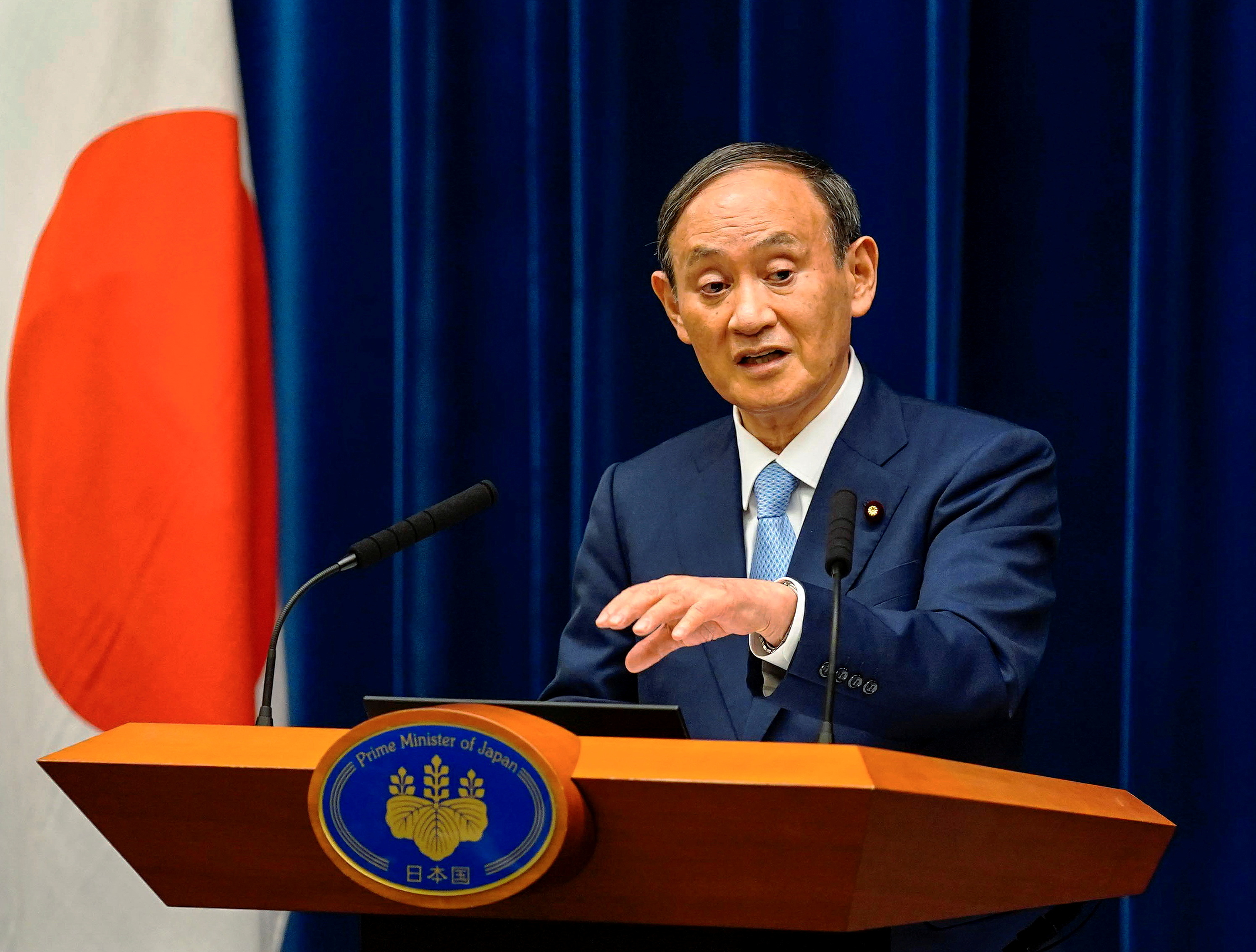 Japanese Prime Minister Yoshihide Suga speaks during a news conference announcing to extend a state of emergency on COVID-19 pandemic