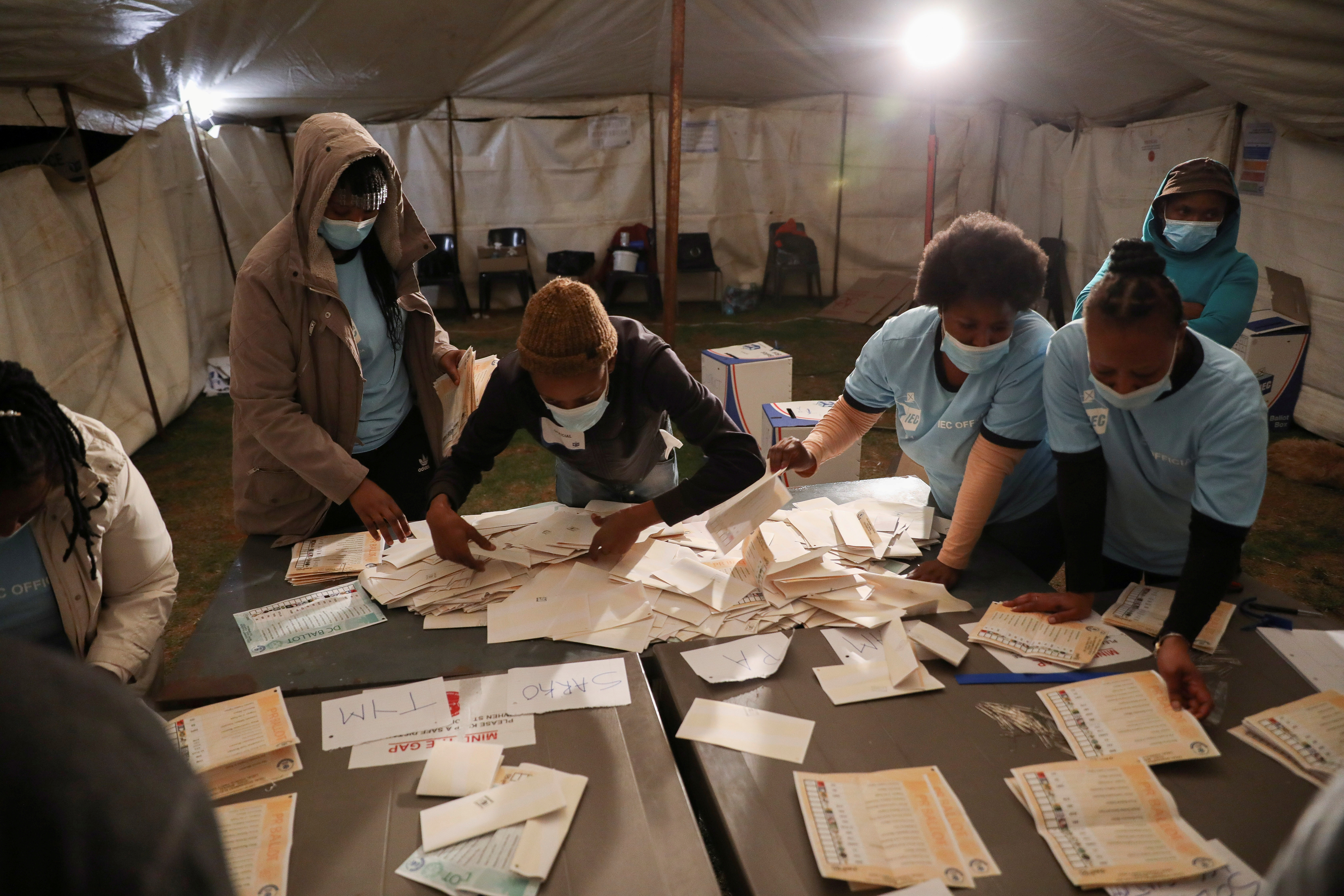 Election officials count ballots after the closing of the local government elections, at a farm in Alewynspoort, outside  Johannesburg, South Africa November 1, 2021.