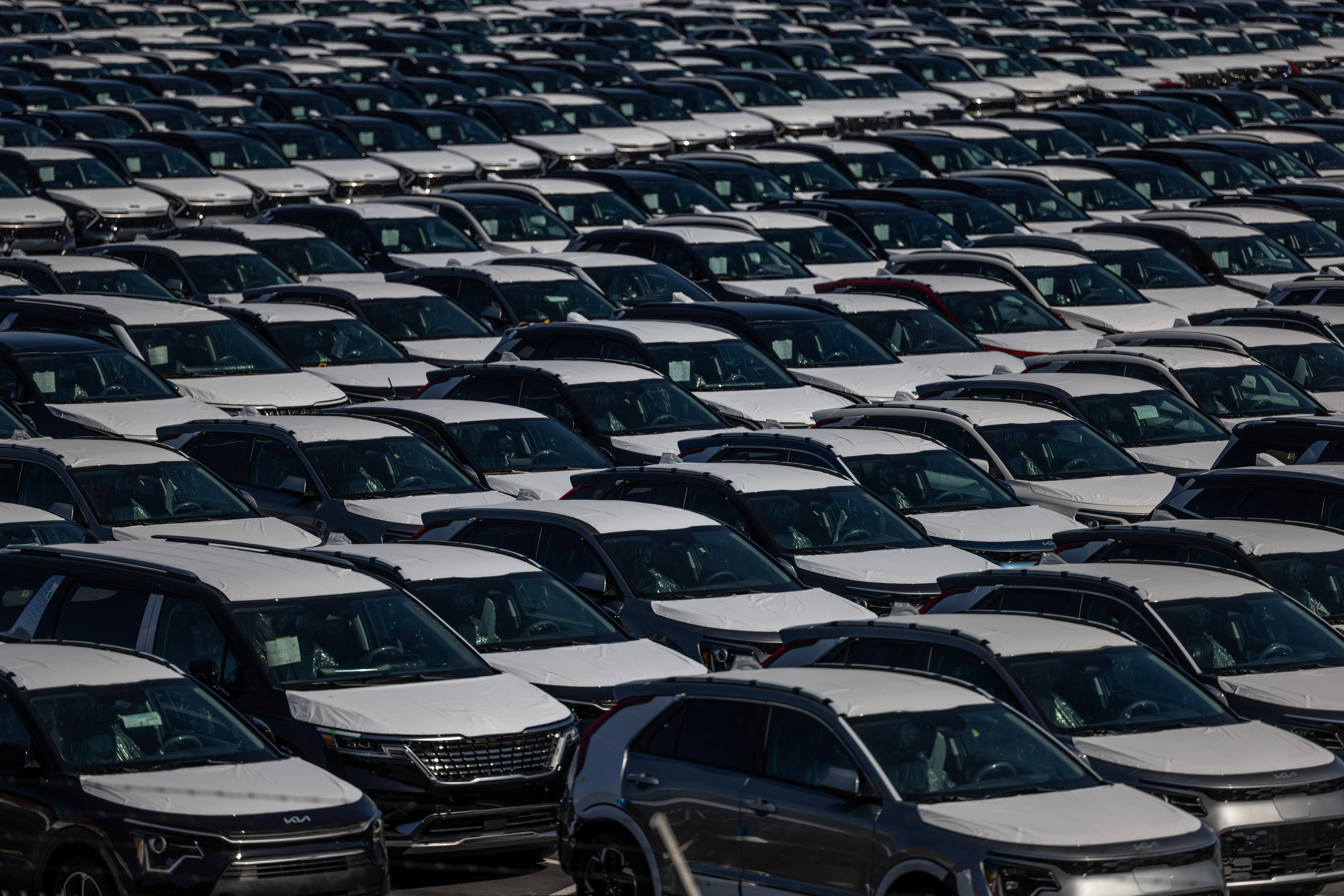 New vehicles are seen at a parking lot in the Port of Richmond, California