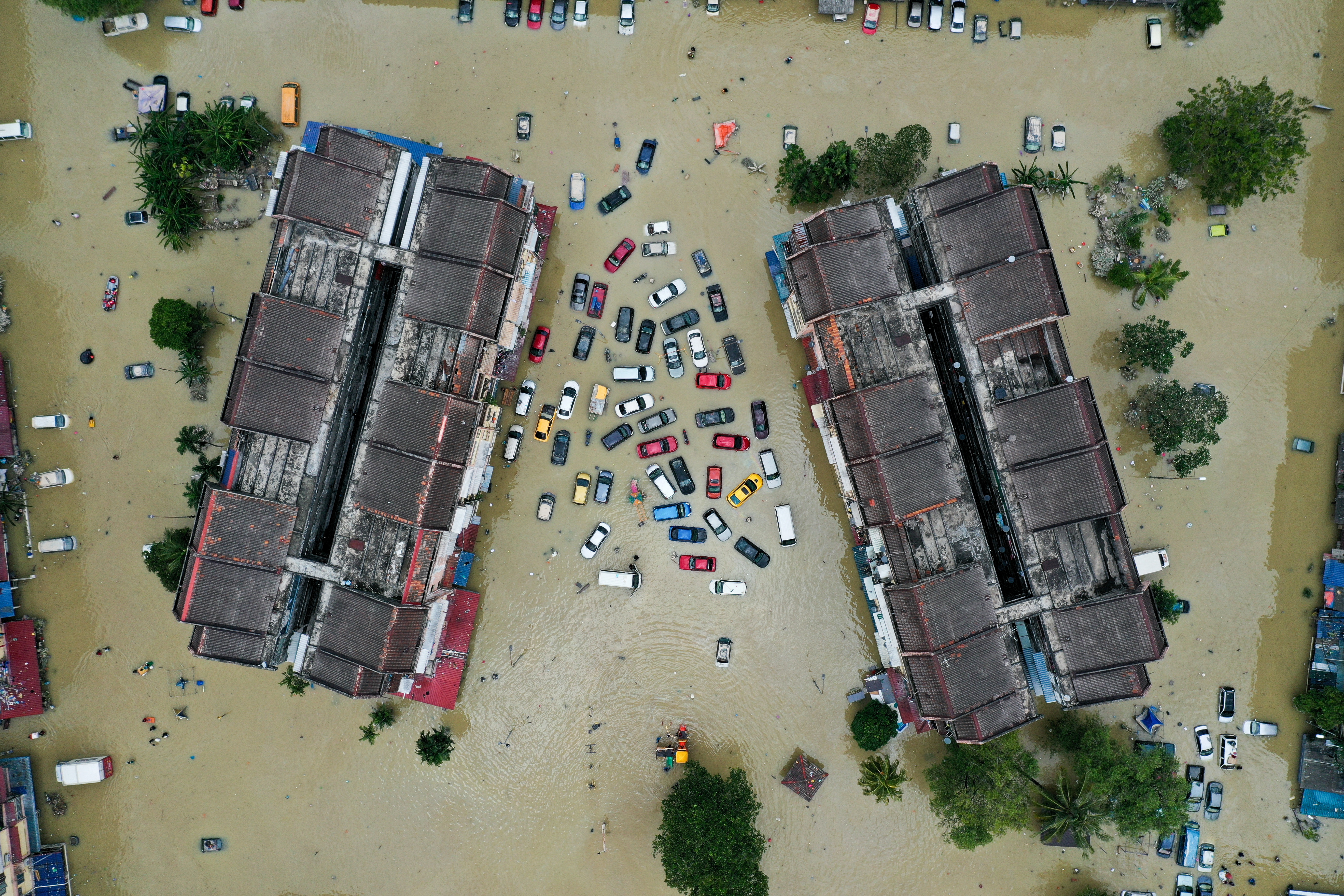 Aerial view shows vehicles submerged in flood waters in Shah Alam