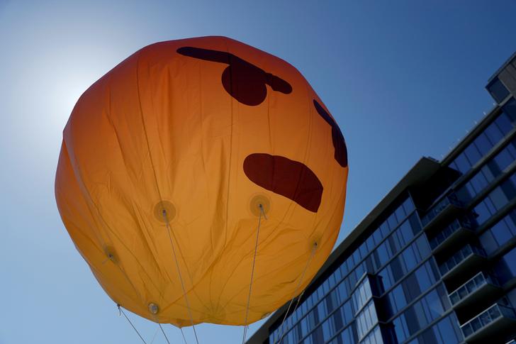 An inflated angry emoji is seen during a protest outside the Facebook 2019 Annual Shareholder Meeting in Menlo Park, California