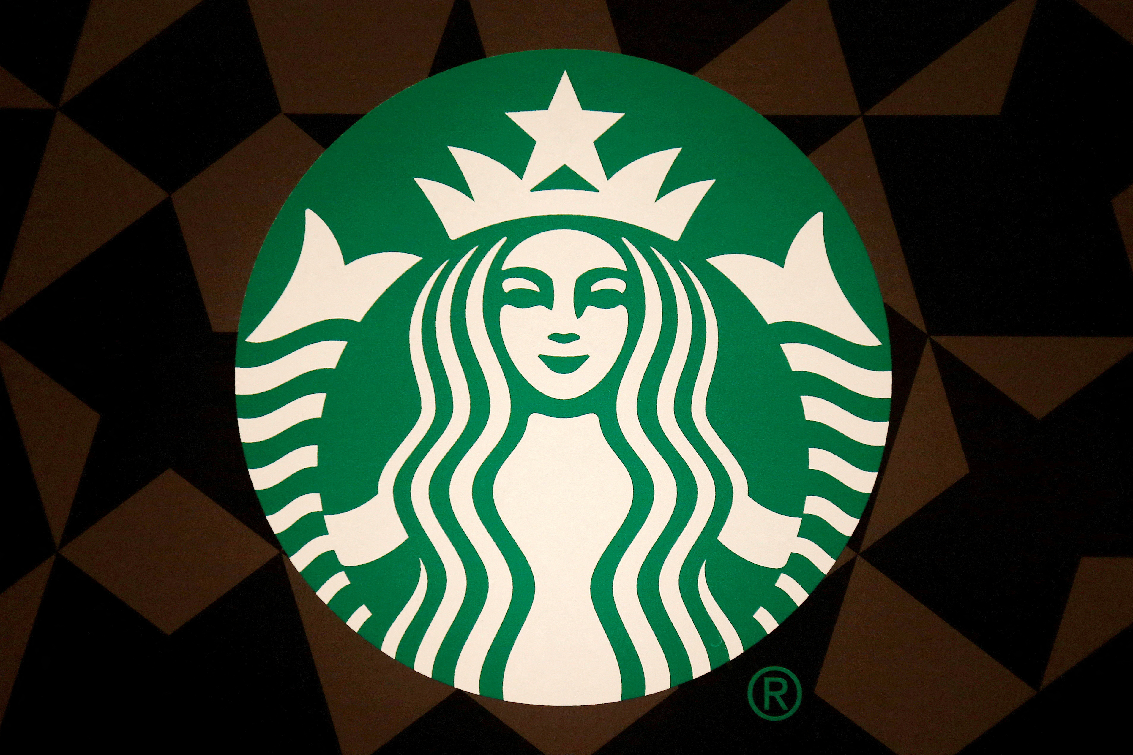 FILE PHOTO: A Starbucks logo is pictured on the door of the Green Apron Delivery Service at the Empire State Building in New York