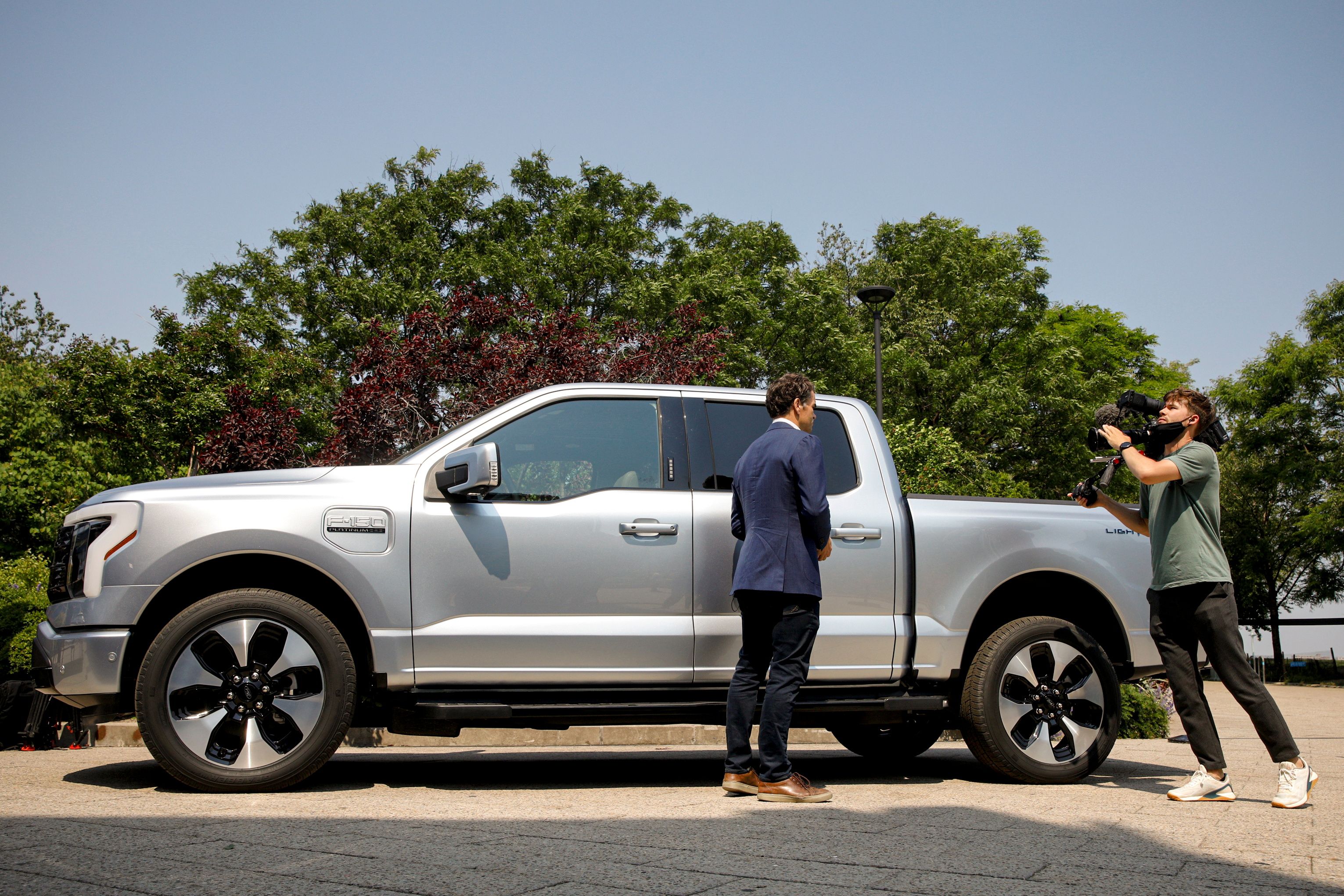 A news crew films the Ford F-150 Lightning pickup truck during a press event in New York City, U.S., May 26, 2021.  REUTERS/Brendan McDermid