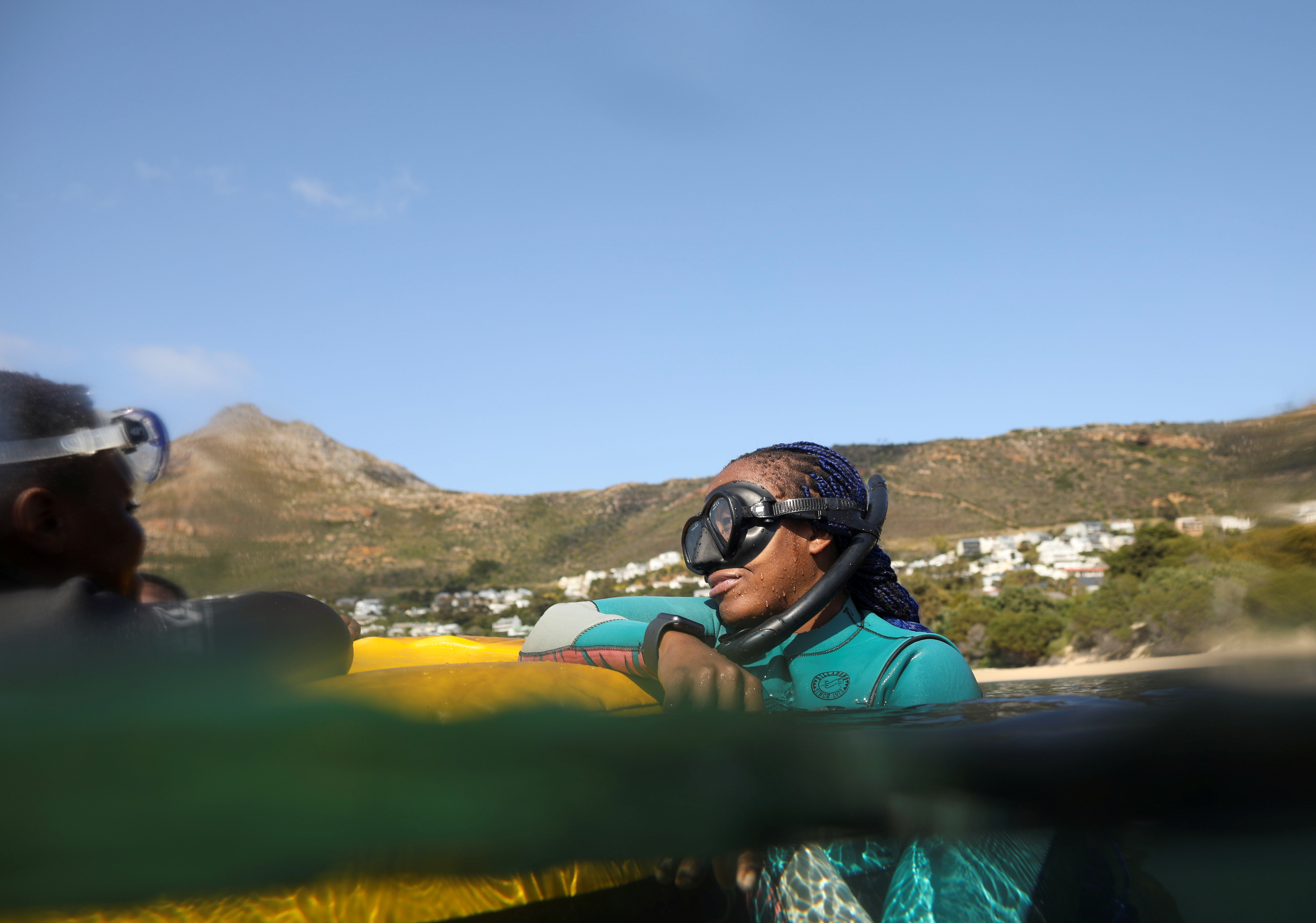 Free diver Zandile Ndlovu encourages township youngsters as they explore the marine world off Simonstown