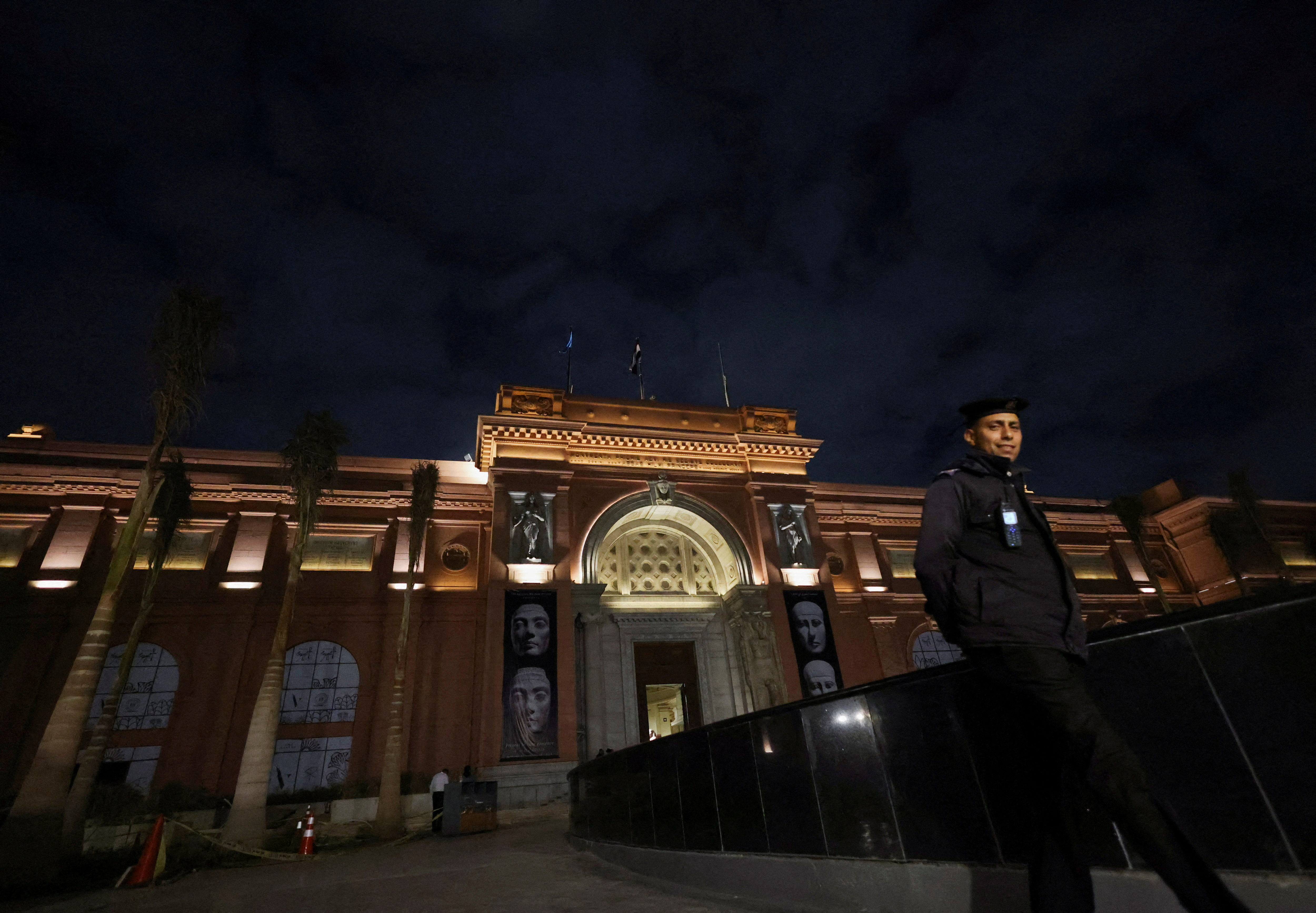 A police officer walks next to an entrance of the Egyptian Museum  in Egypt's capital of Cairo
