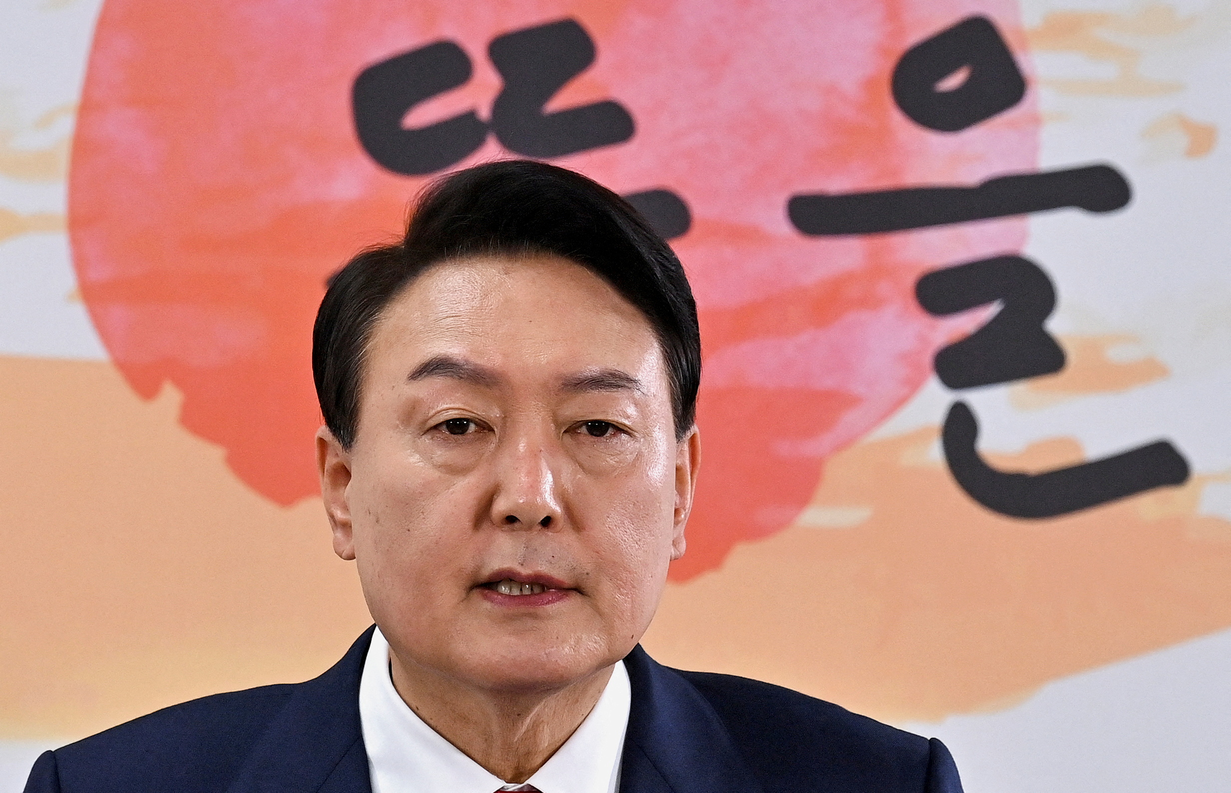 South Korea's president-elect Yoon Suk-yeol holds a news conference about his presidential office's relocation plans, in Seoul