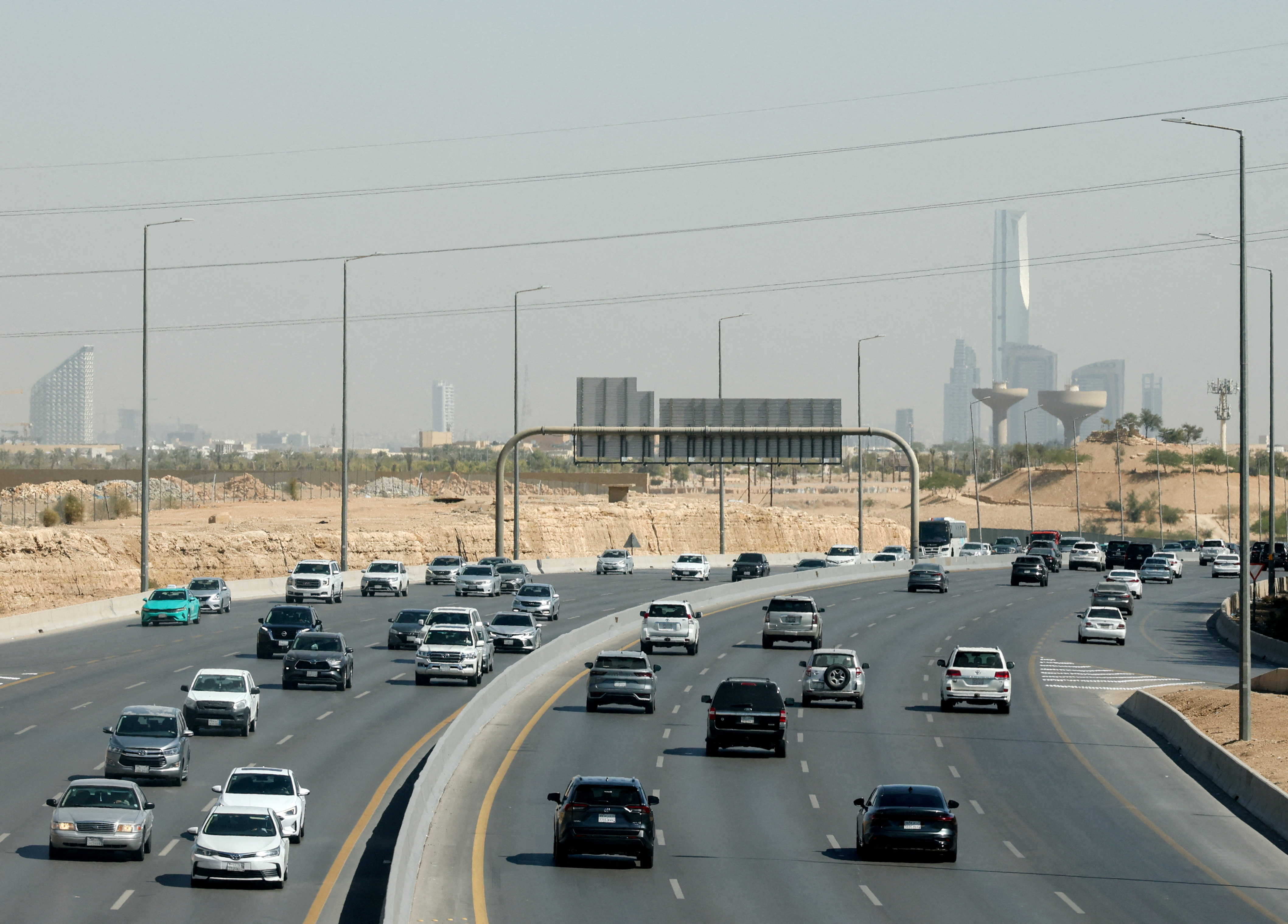 Traffic moves on a road, with the city’s skyline visible in the background, in Riyadh, Saudi Arabia on February 9, 2026. — Reuters