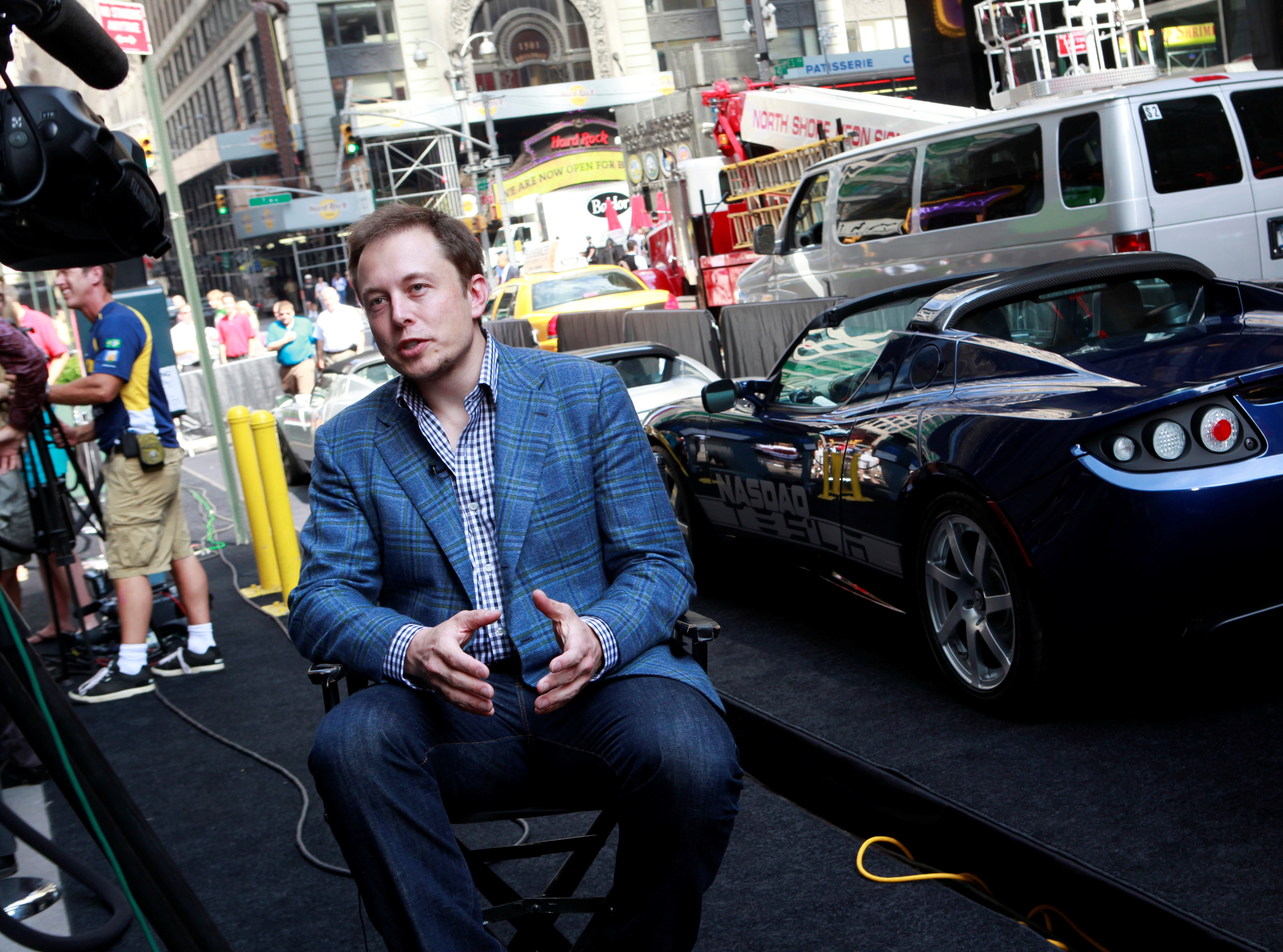 CEO of Tesla Motors Elon Musk speaks during a television interview after his company's initial public offering at the NASDAQ market in New York, June 29, 2010. REUTERS/Brendan McDermid/File Photo
