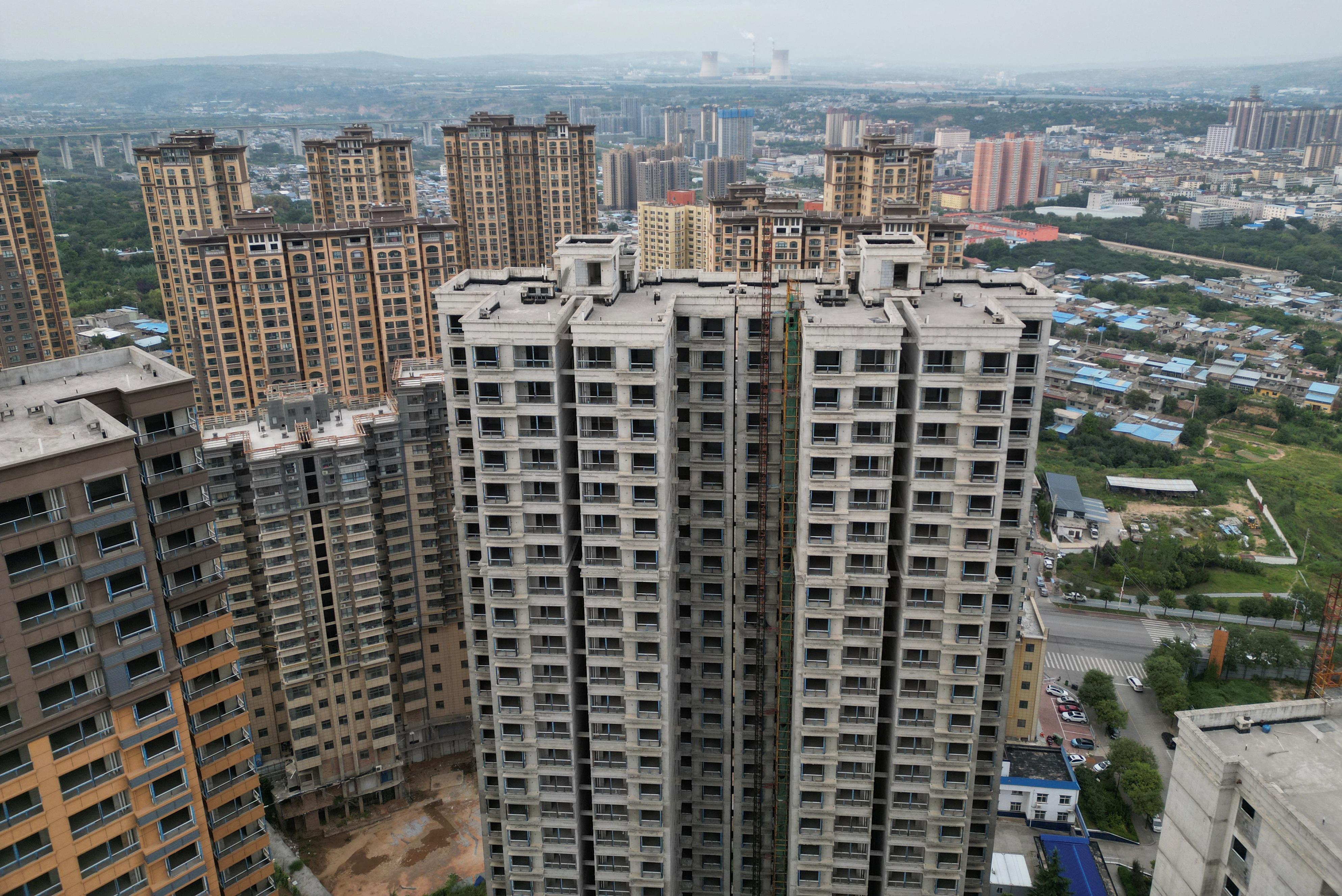 Aerial view shows unfinished residential buildings in Tongchuan