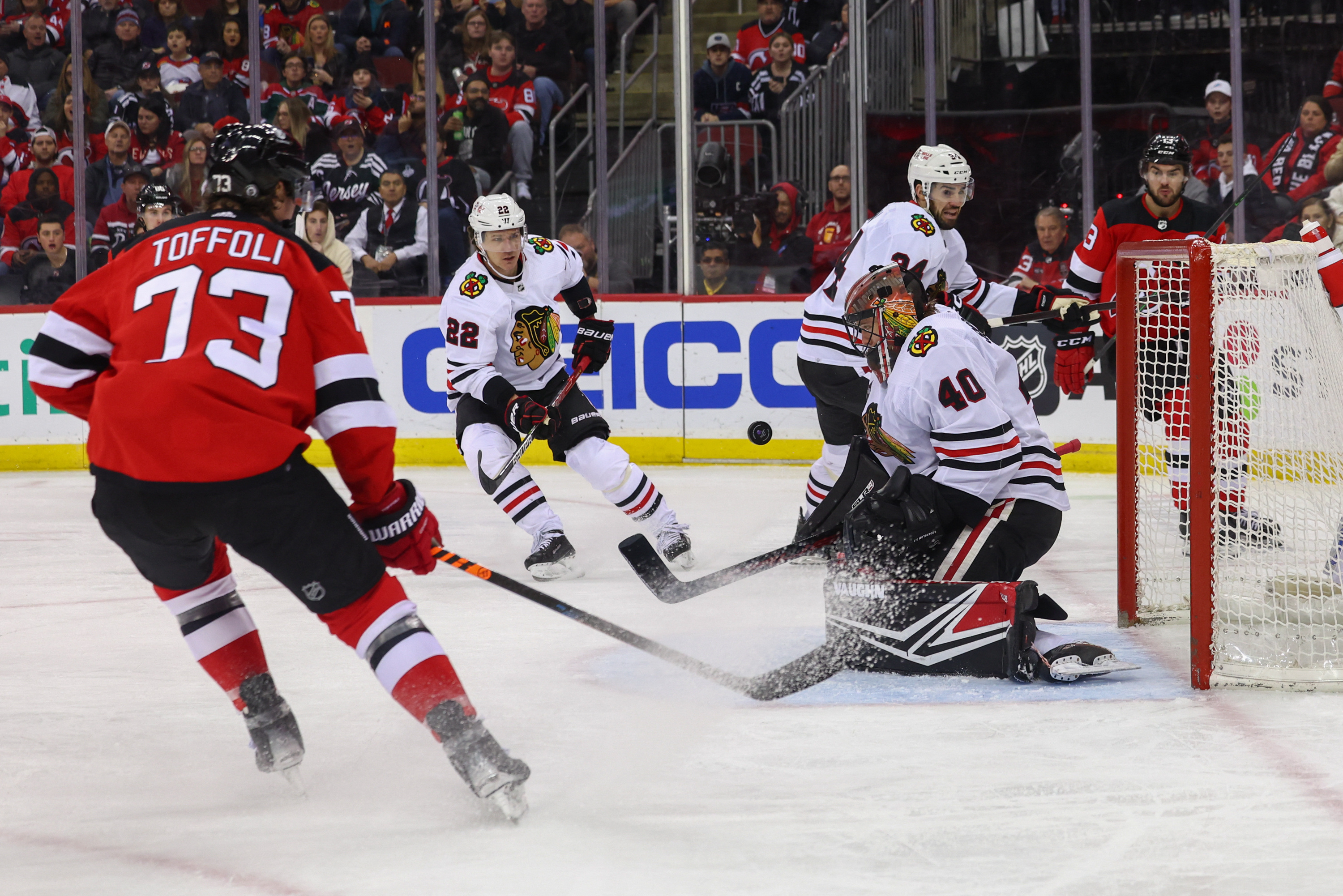 Streaking Devils continue Blackhawks' misery with 4-2 win | Reuters