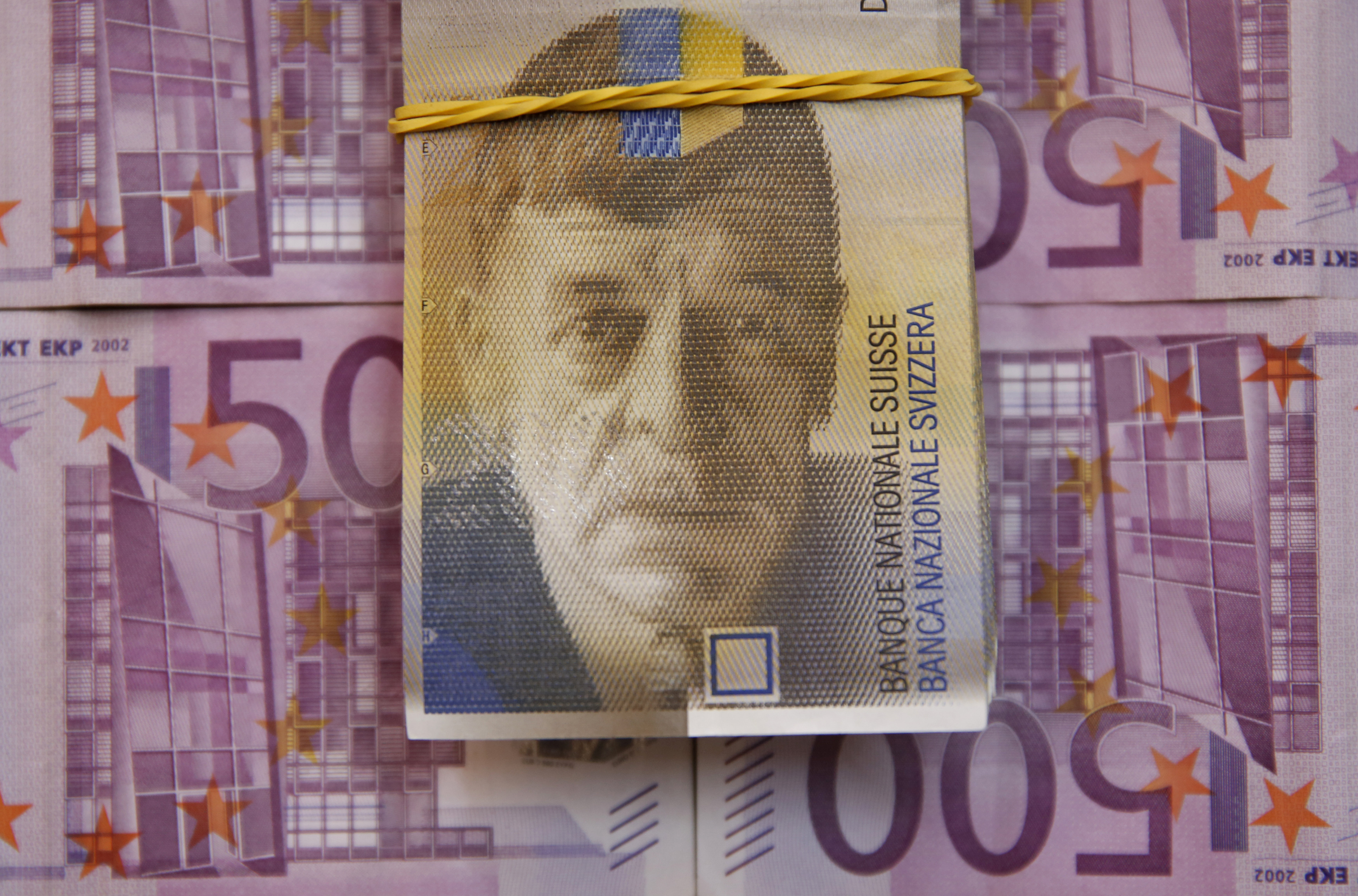 A picture illustration of Swiss Franc and Euro banknotes taken in central Bosnian town of Zenica