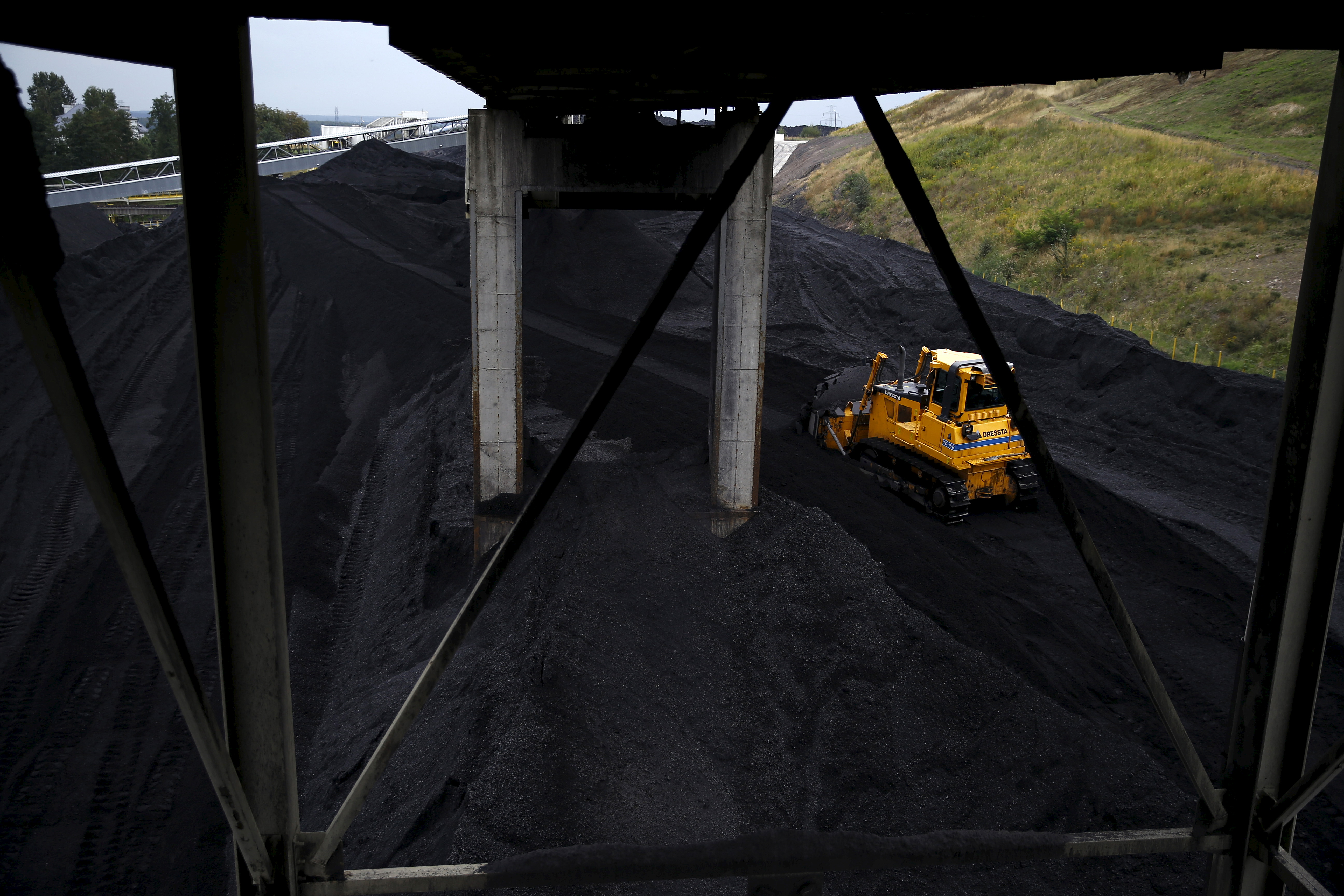 A bulldozer works on a heap of coal at the Boleslaw Smialy coal mine, a unit of coal miner Kompania Weglowa (KW), in Laziska Gorne