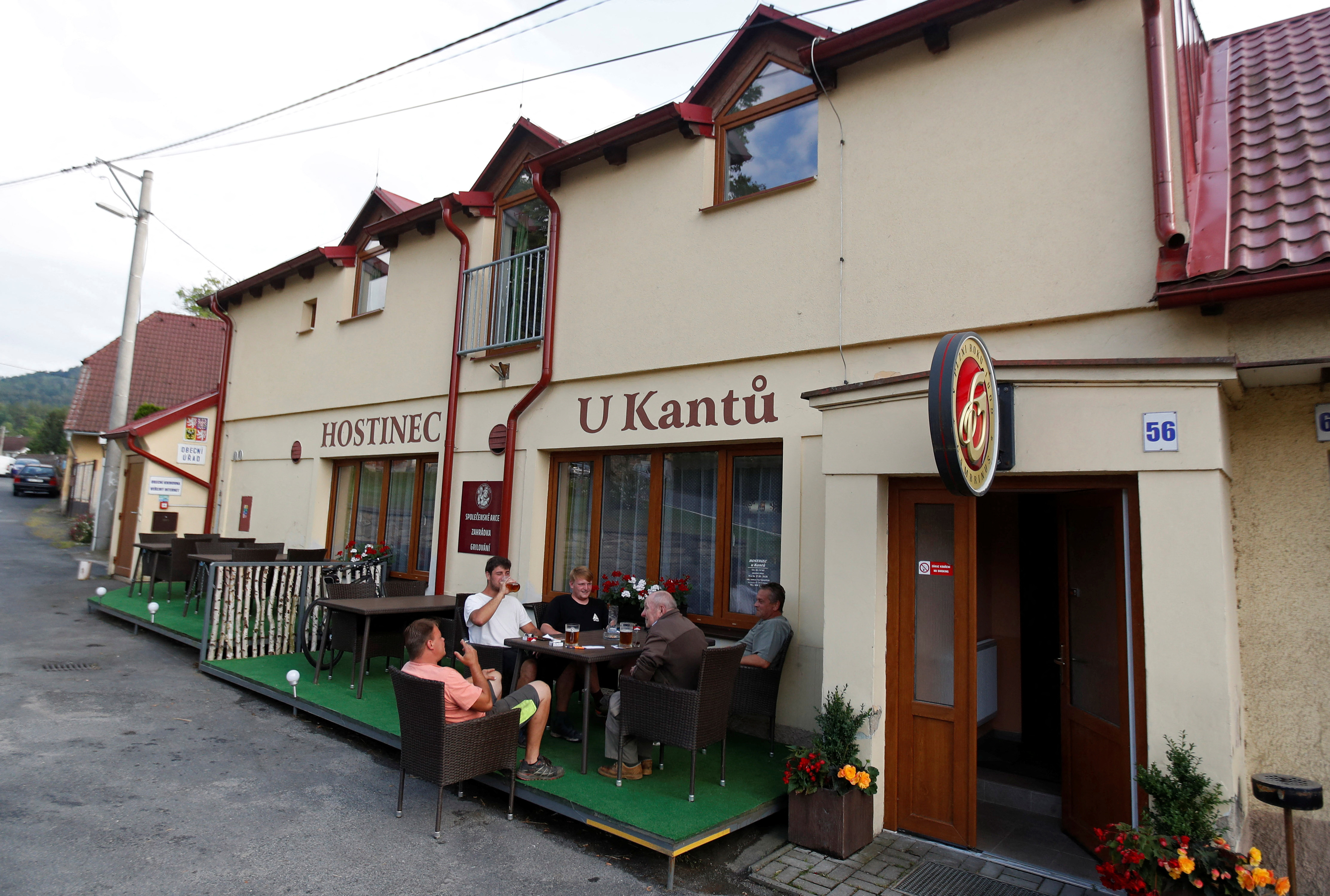 Customers drink beer in the U Kantu pub in the village of Myslovice