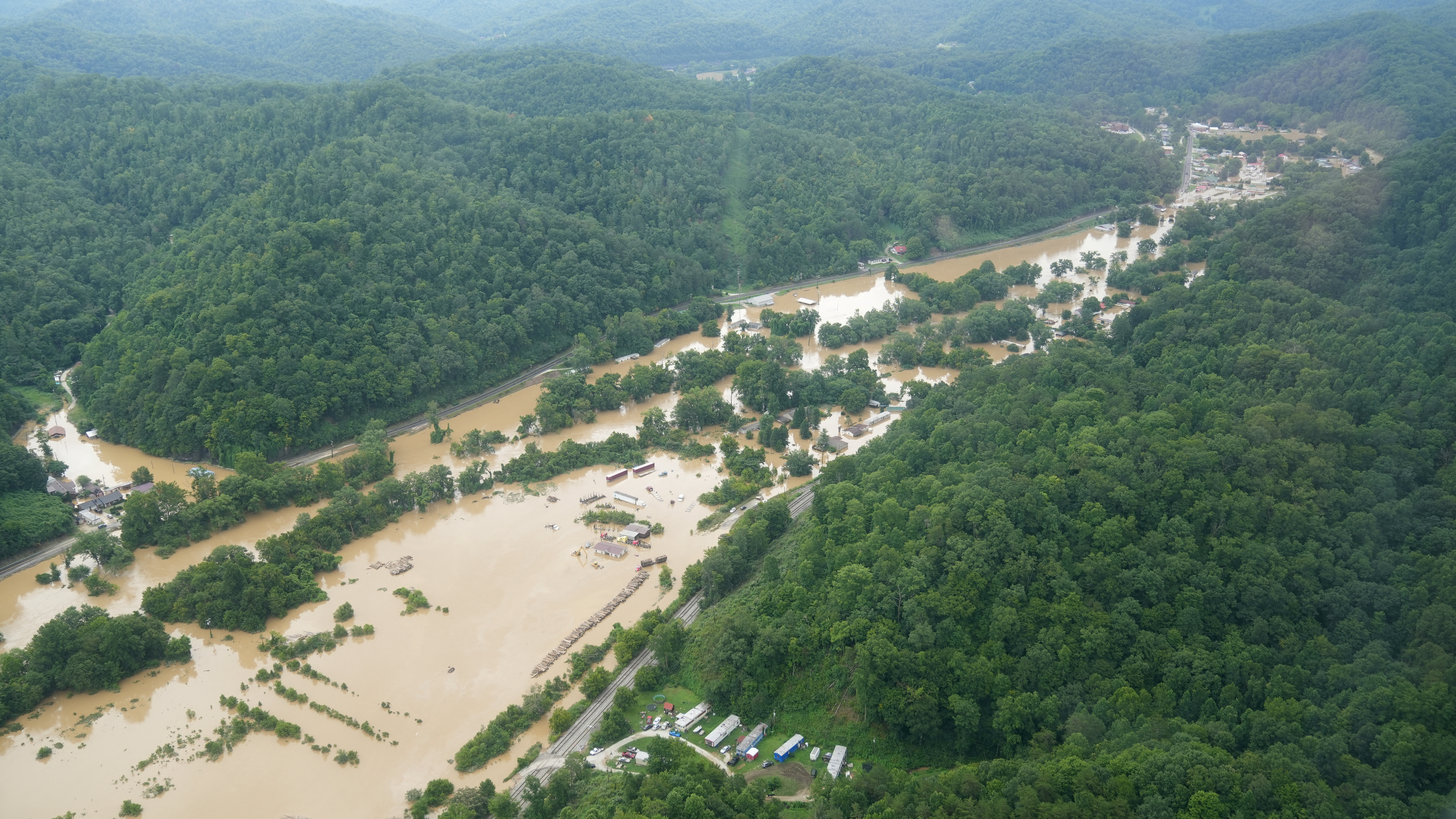 A valley lies flooded as seen from a helicopter during a tour by Kentucky Governor Andy Beshear