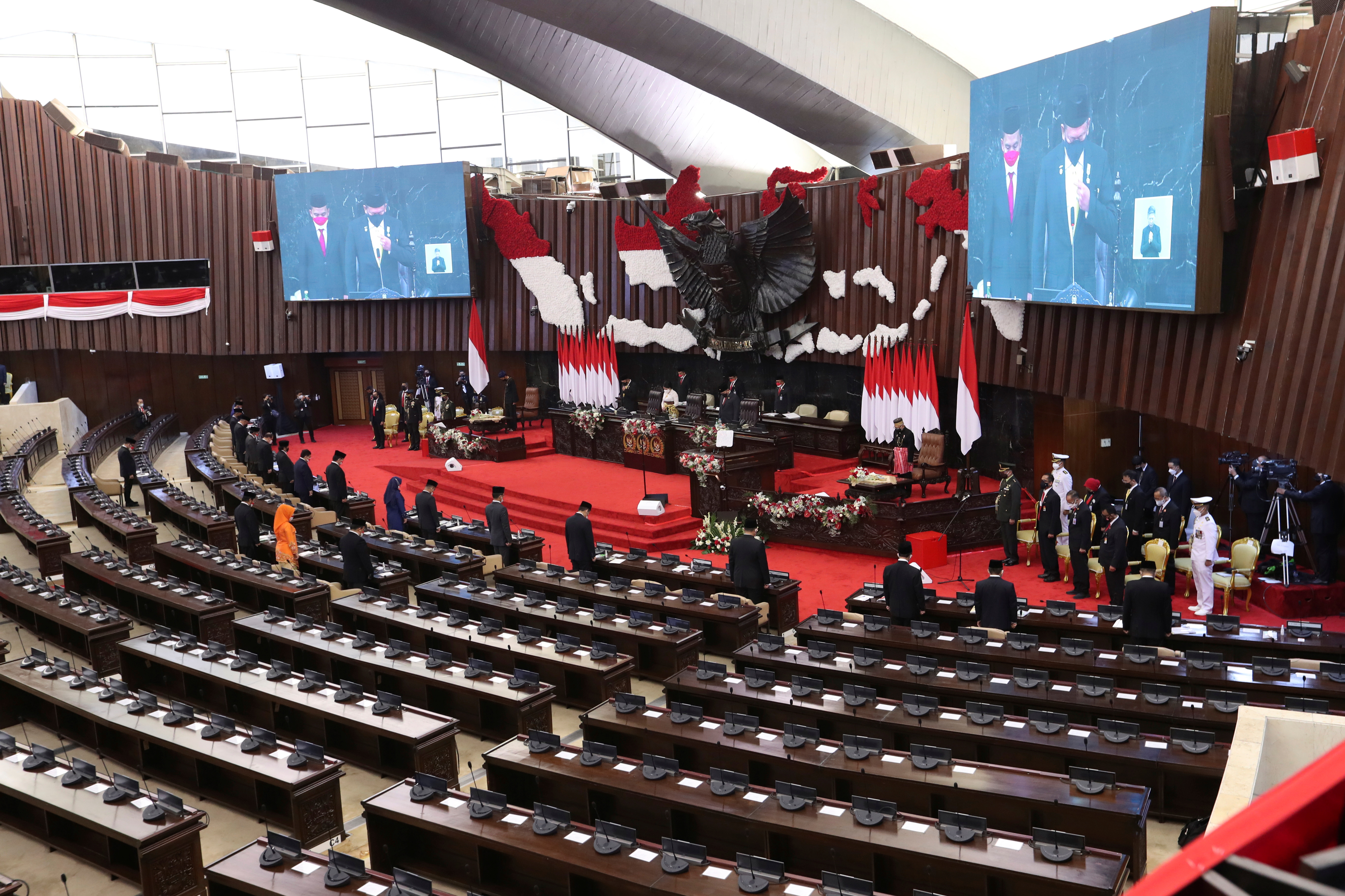 Seats at the main assembly room at the parliament building are left largely empty during the delivery of the annual State of the Nation Address by Indonesian President Joko Widodo in Jakarta