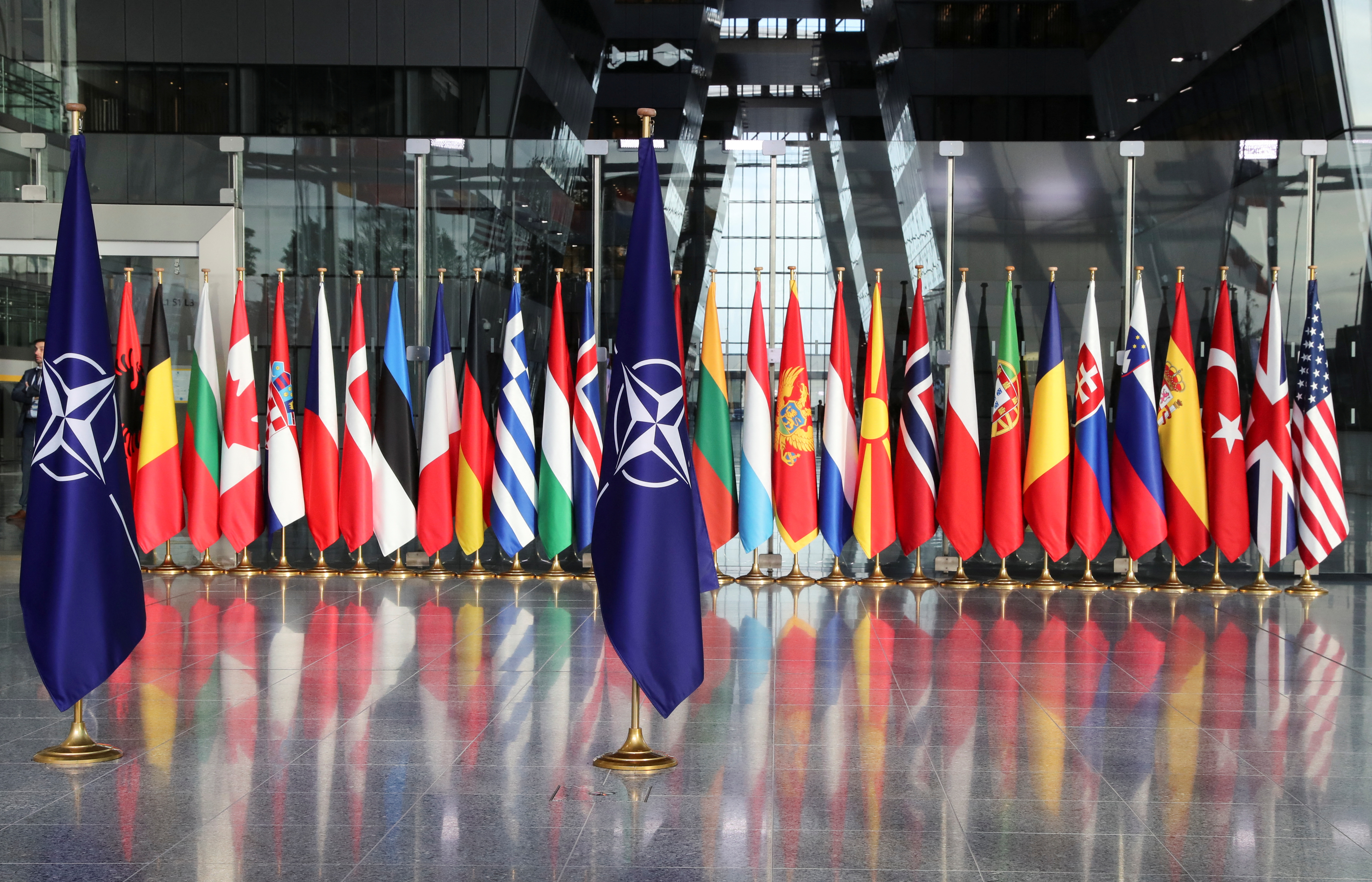 Flags are seen ahead of a NATO Defence Ministers meeting at the Alliance headquarters in Brussels, Belgium, October 21, 2021. REUTERS/Pascal Rossignol