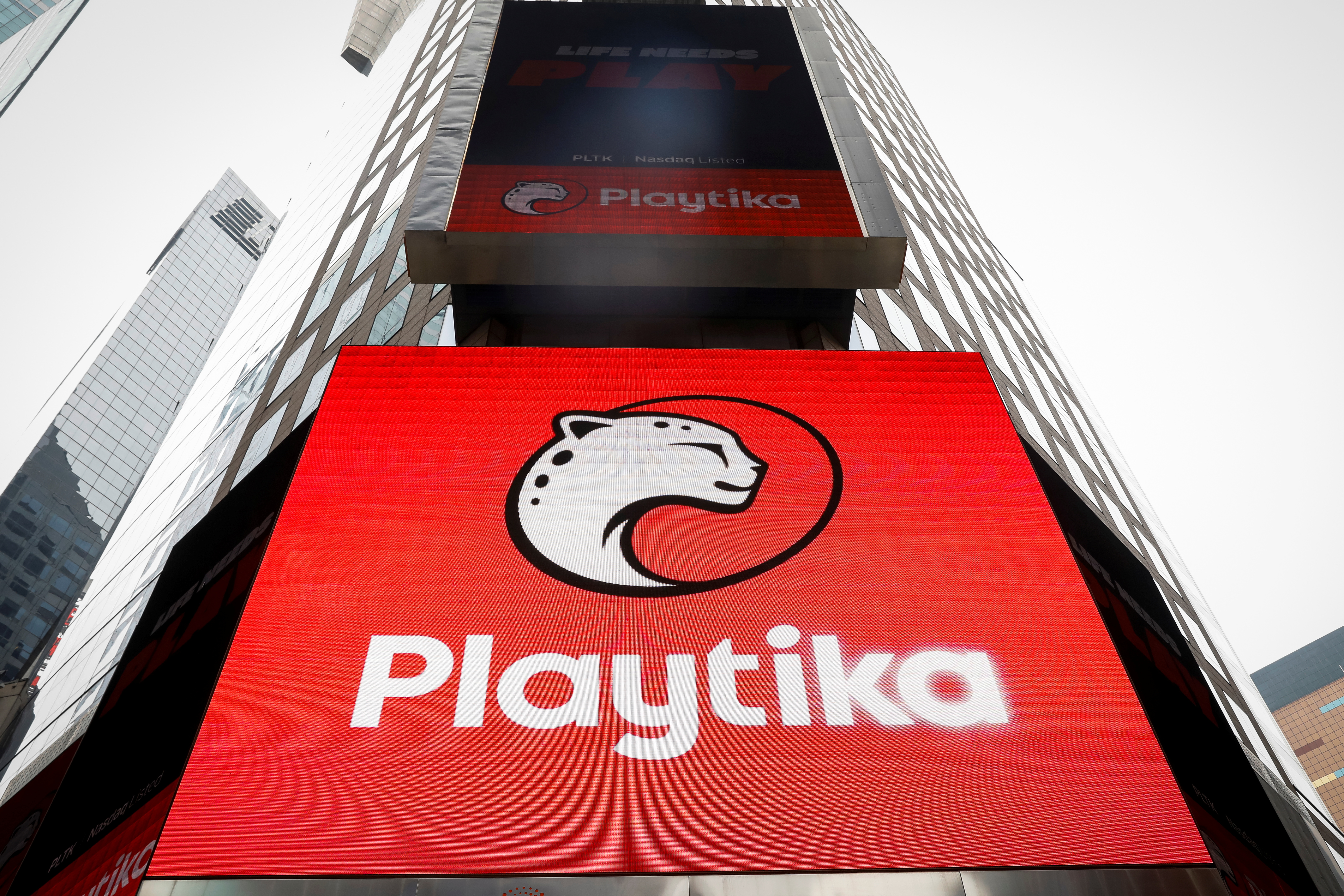 A screen displays mobile gaming company Playtika Holding Corp company logo during the company's IPO in Times Square in New York
