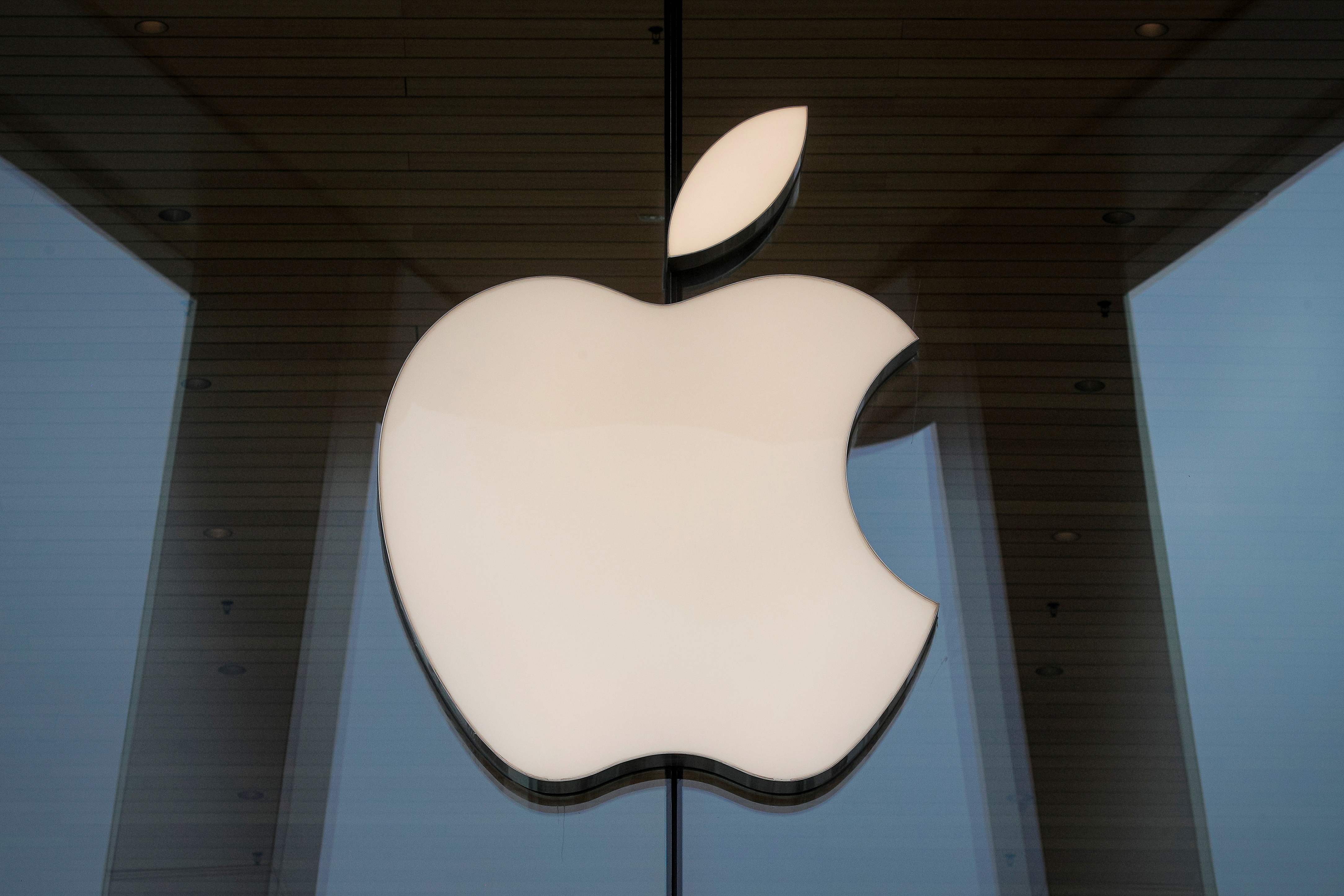 The Apple logo is seen at an Apple Store, as Apple's new 5G iPhone 12 went on sale in Brooklyn, New York