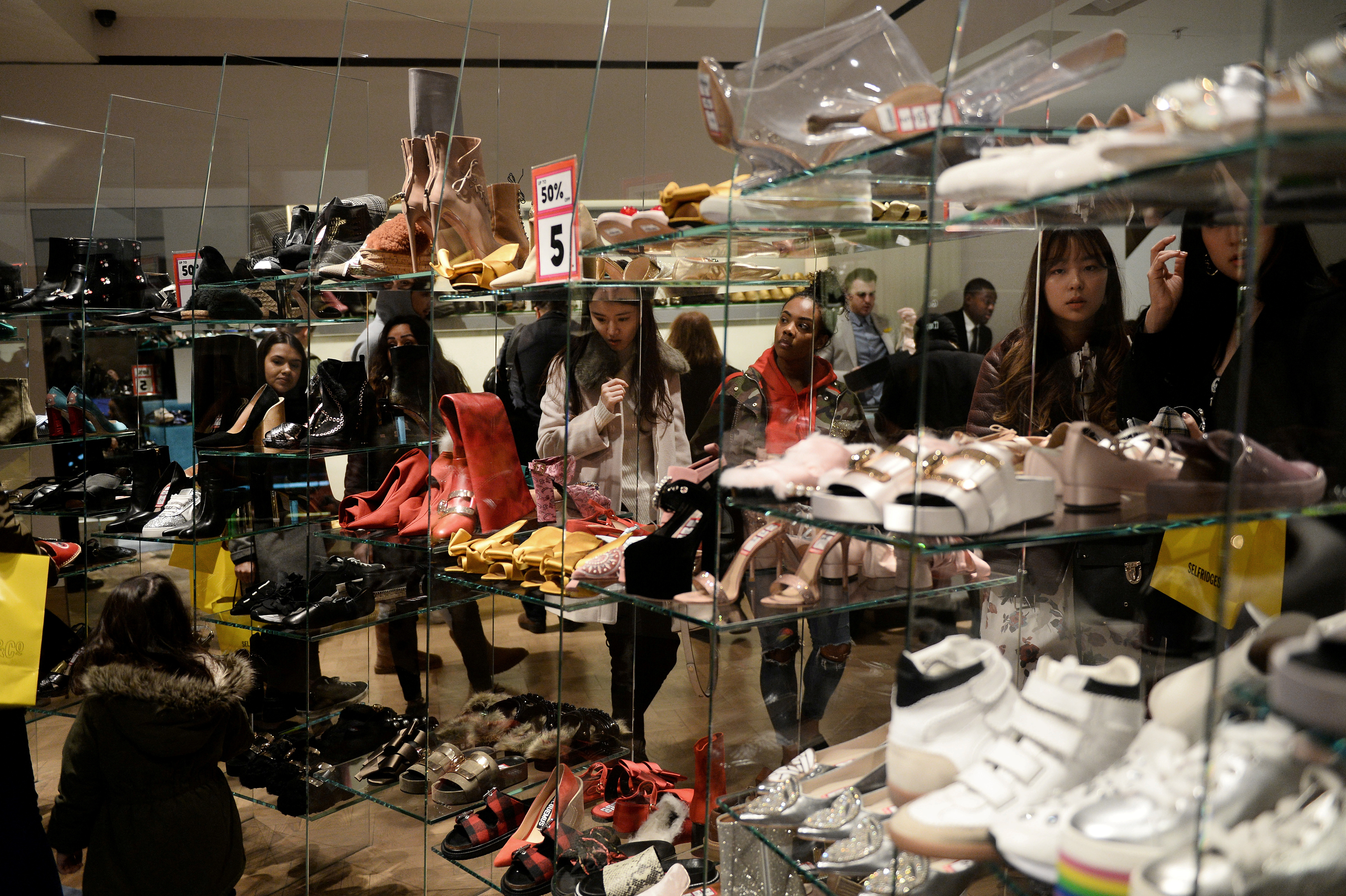Shoppers browse for shoes at Selfridges in London