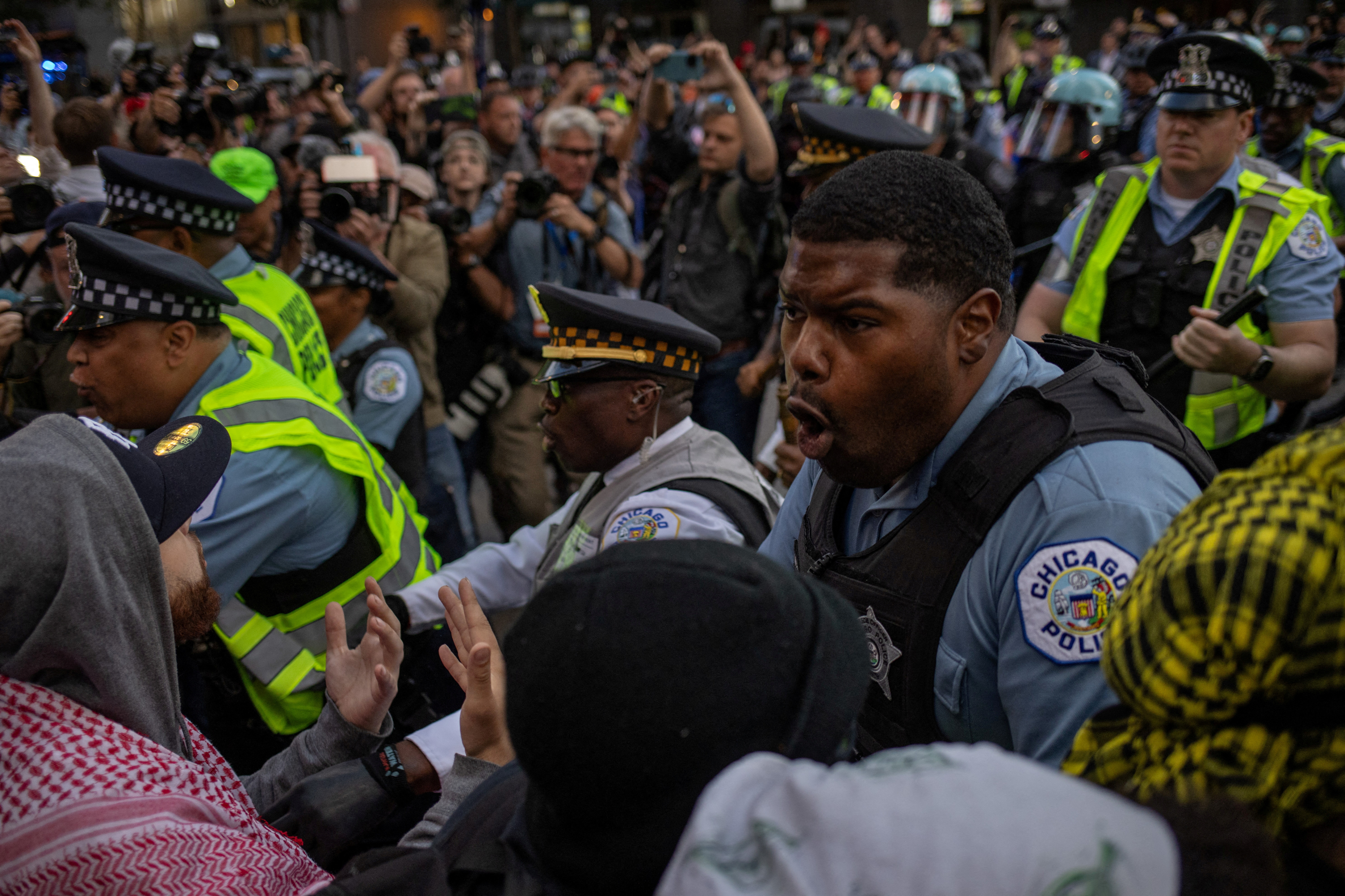 Police scuffle with pro-Palestinian protesters outside the Israeli consulate during the DNC in Chicago