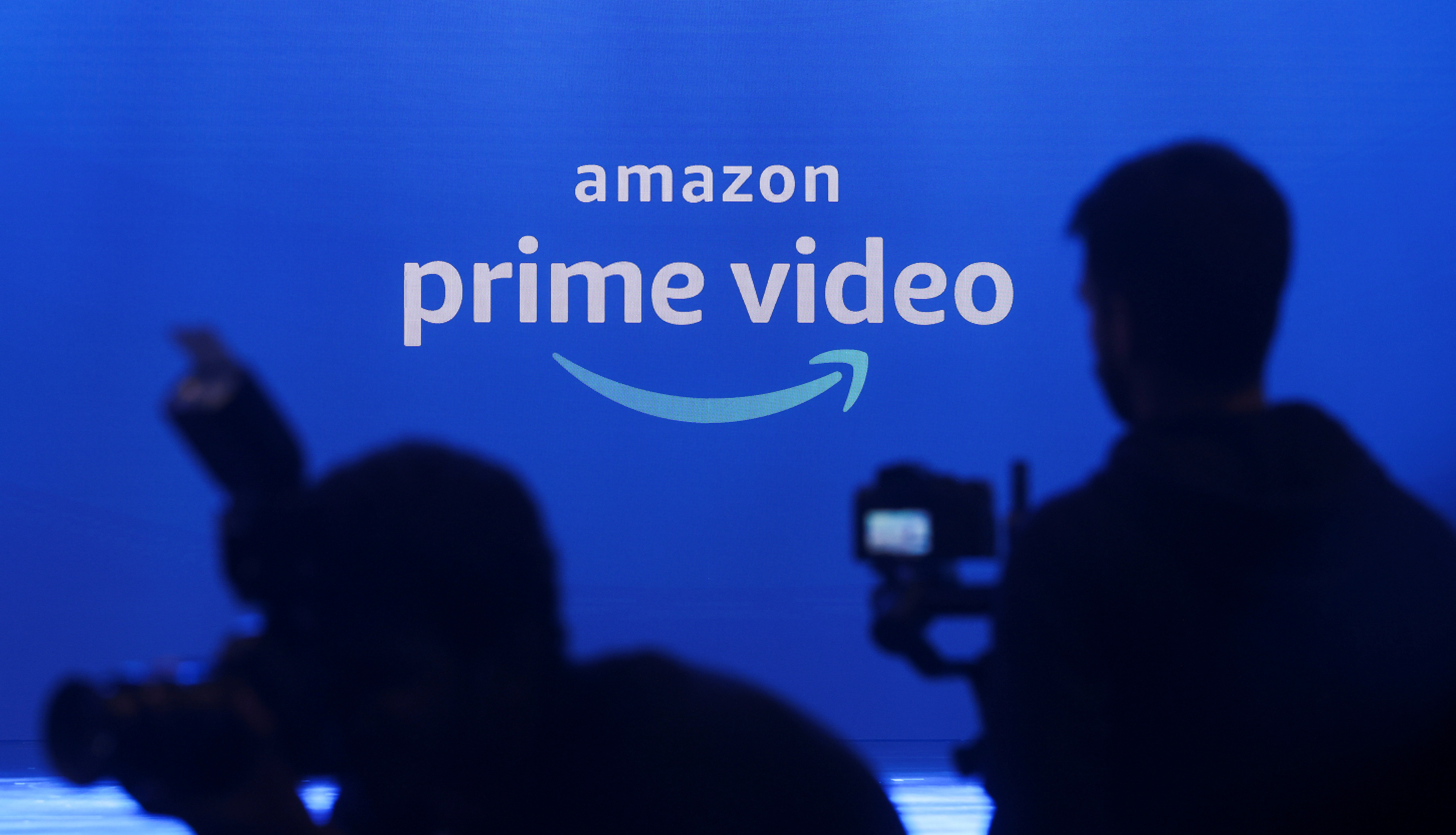 Media are seen in front of an Amazon Prime Video logo during an Amazon Prime Video India launch event in Mumbai