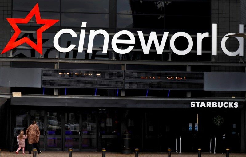 FILE PHOTO: FILE PHOTO: People enter a Cineworld cinema following the outbreak of the coronavirus disease (COVID-19) near Manchester