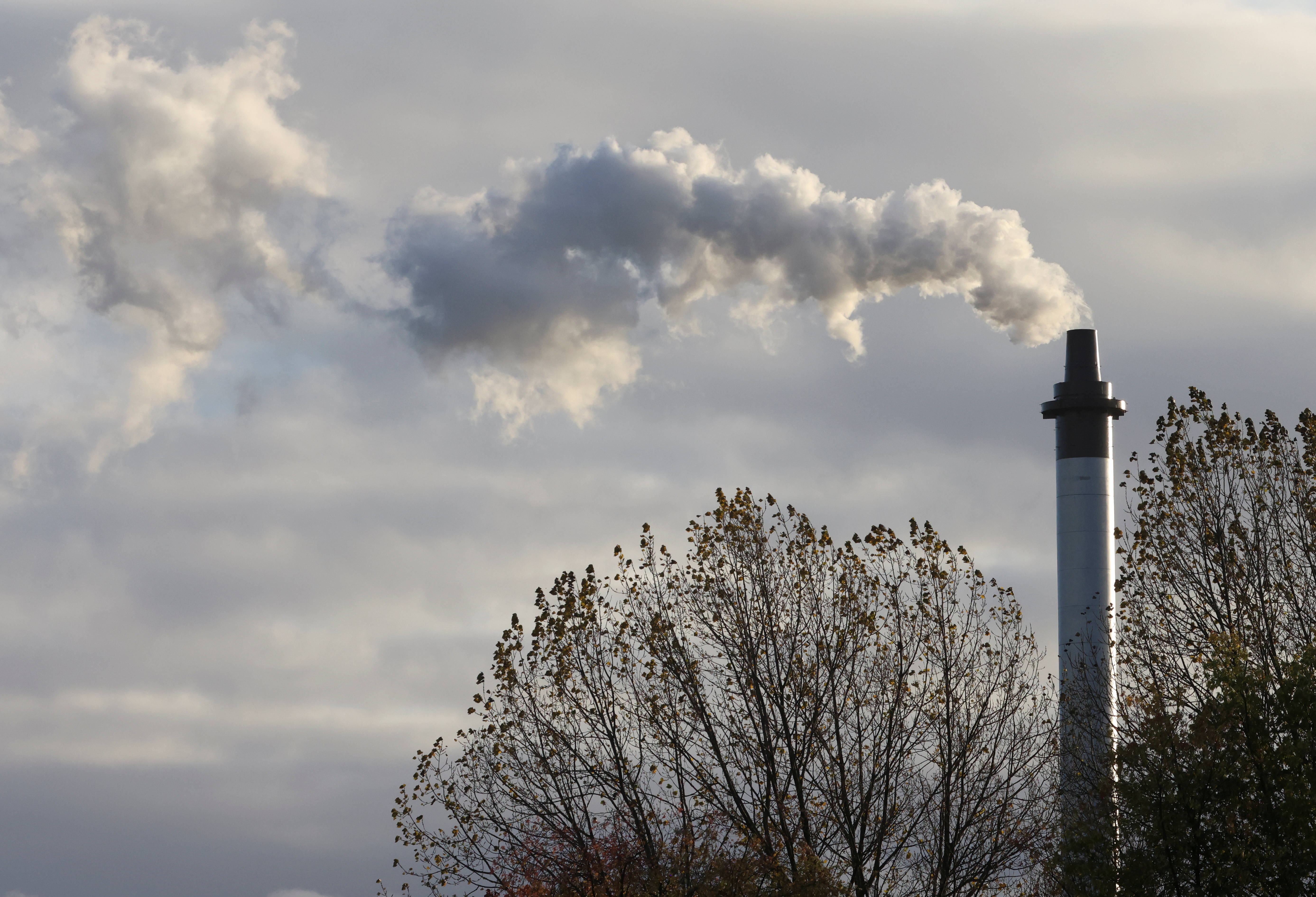 A smoke billowing from a chimney is pictured, as the UN Climate Change Conference (COP26) takes place, in Glasgow, Scotland, Britain, November 6, 2021. REUTERS/Yves Herman