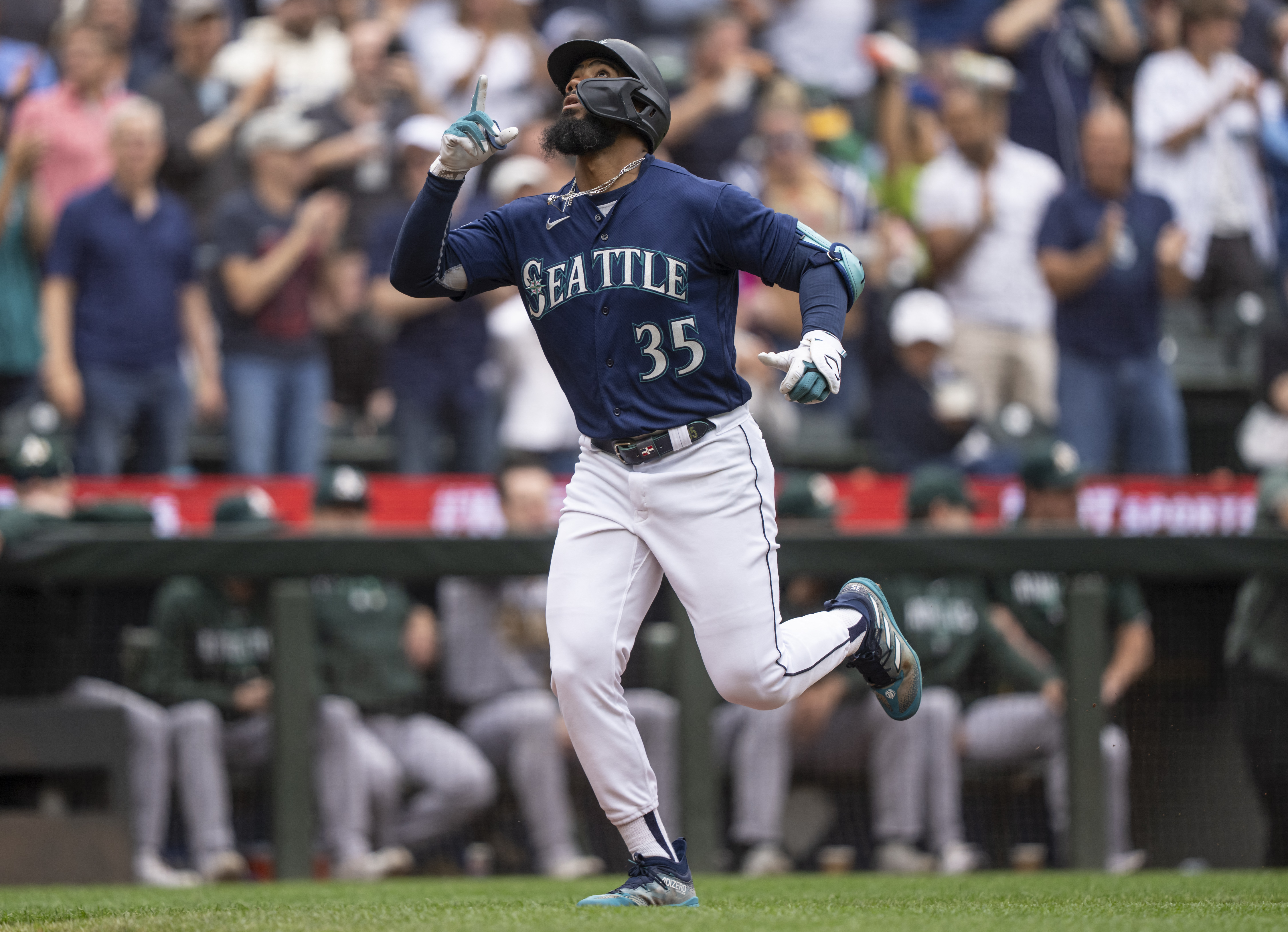 Seattle Mariners Vs. New York Mets Seattle Mariners Teoscar Hernandez 35 is  handed the trident after