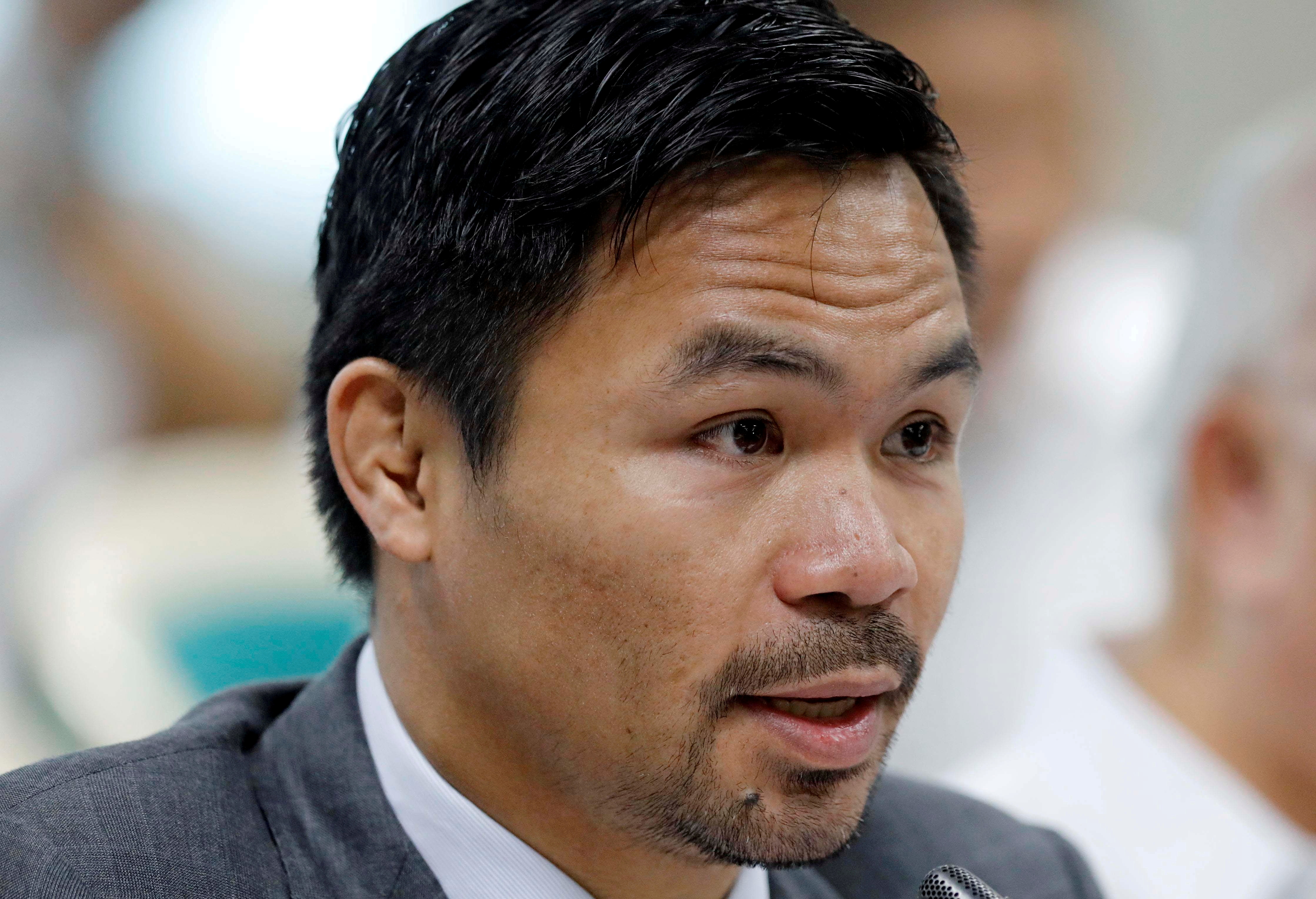Philippine Senator and boxer Manny Pacquiao speaks during the Congressional confirmation hearing of Environment Secretary Regina Lopez at the Senate in Manila, Philippines May 2, 2017.  REUTERS/Erik De Castro/File Photo