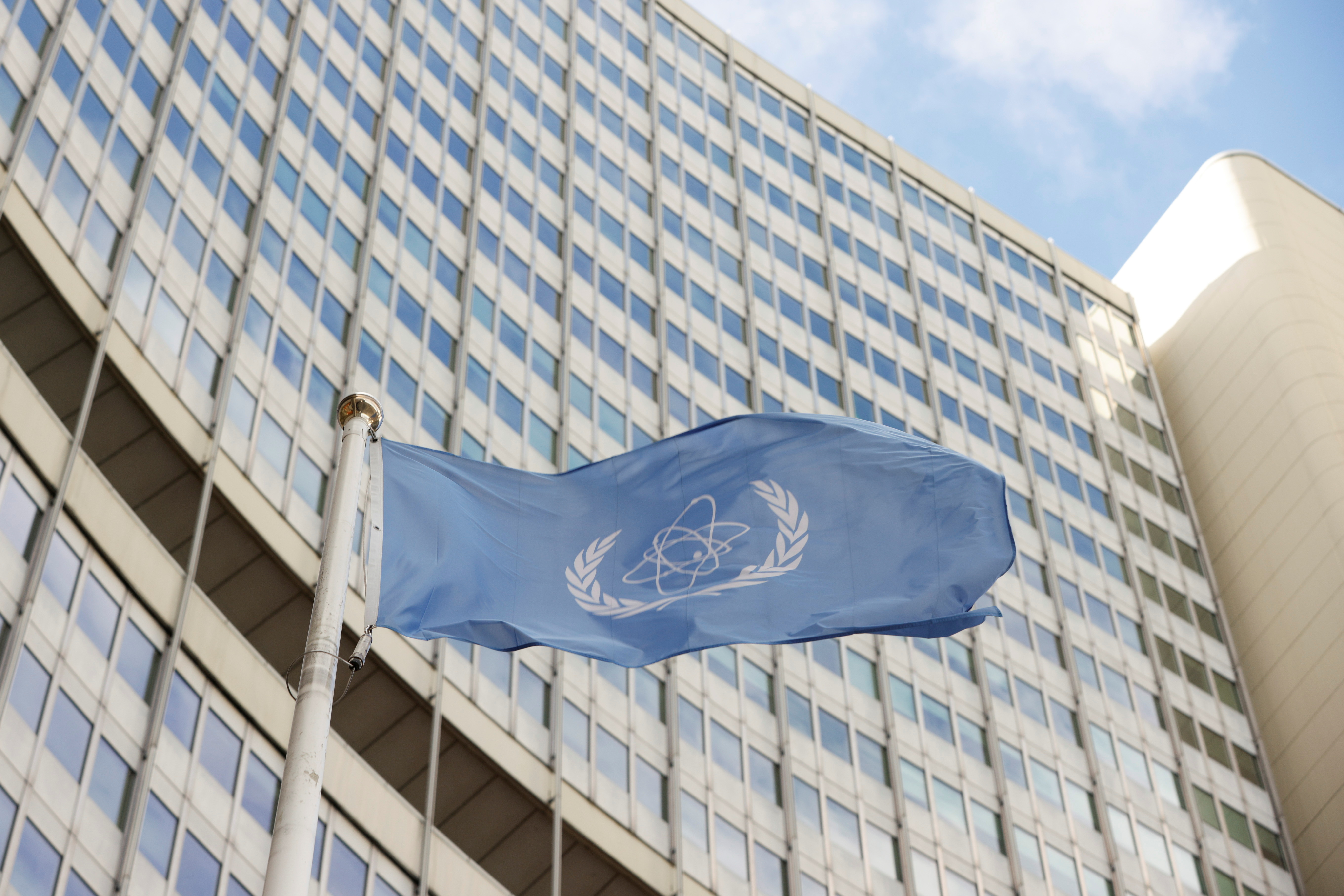 The flag of the International Atomic Energy Agency (IAEA) waves in front its headquarters, amid the coronavirus disease (COVID-19) pandemic, in Vienna