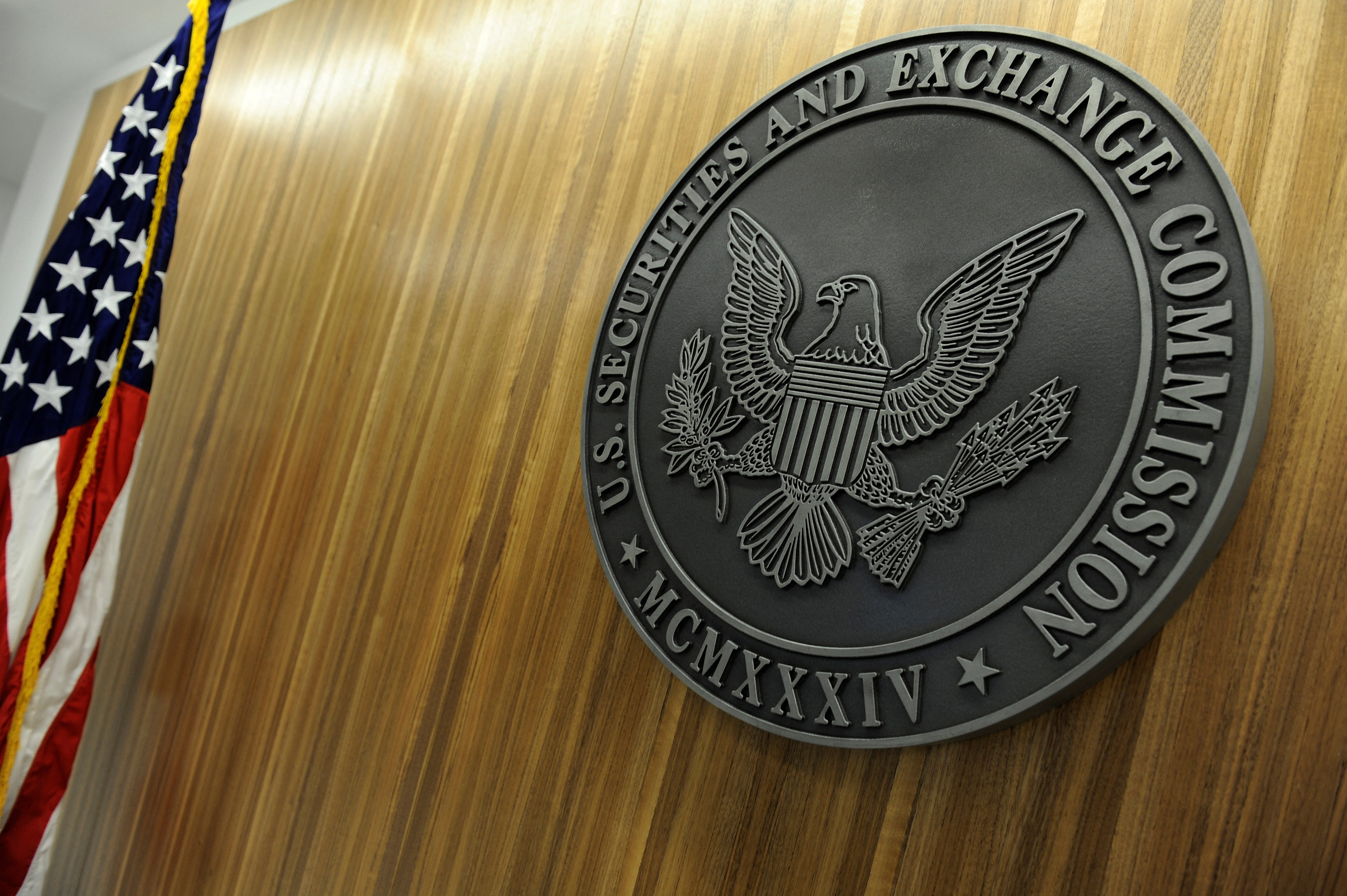The seal of the U.S. Securities and Exchange Commission hangs on the wall at SEC headquarters