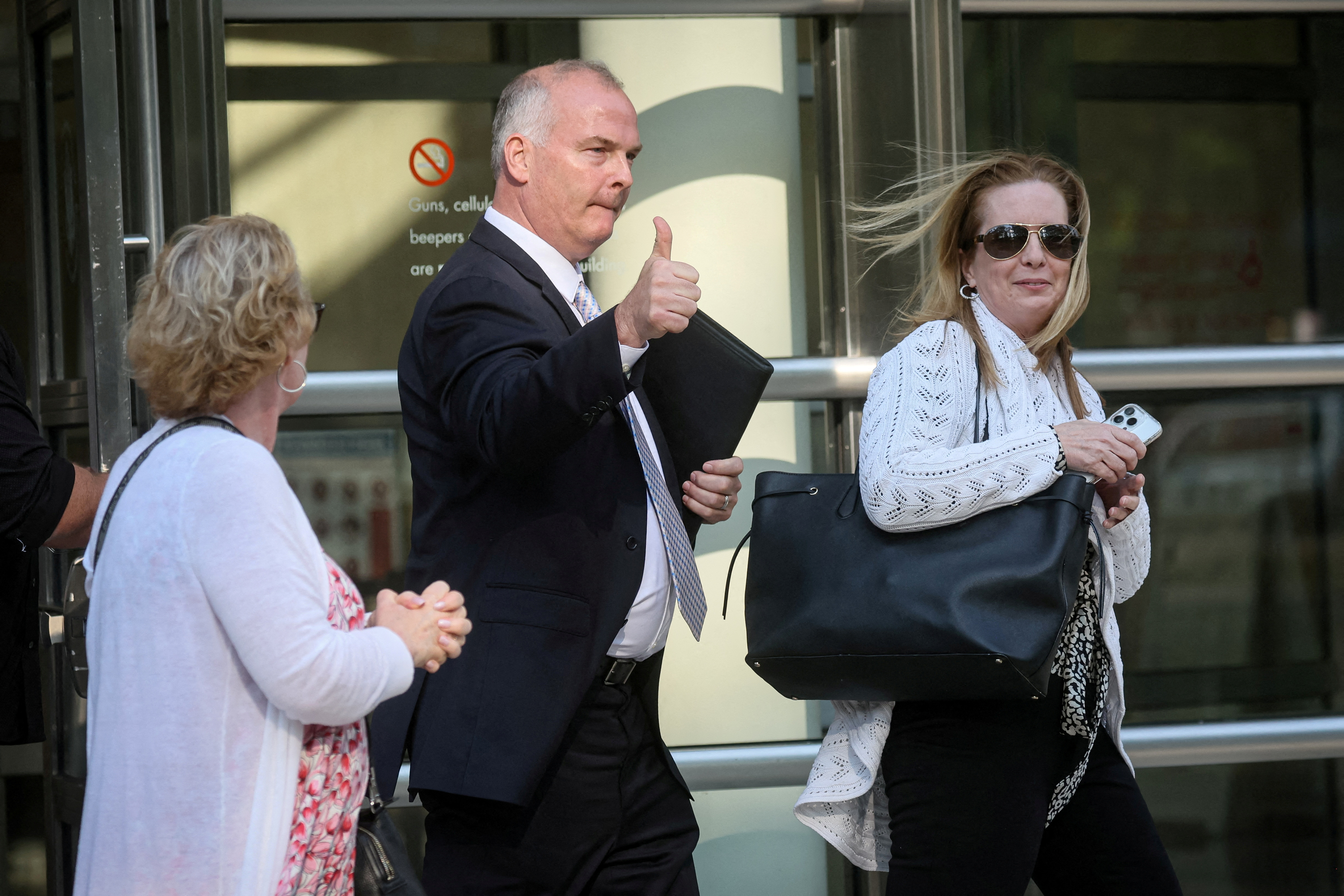 Michael McMahon, a retired NYPD sergeant working as a private investigator, exits the Brooklyn federal courthouse in Brooklyn, New York